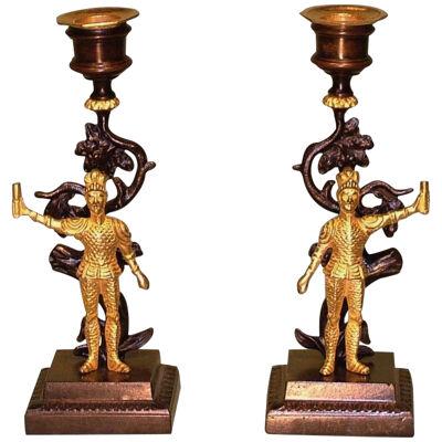 A pair of 19th Century bronze and ormolu knight Candlesticks.