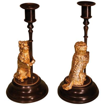 A pair of English mid 19th century bronze and ormolu candlesticks