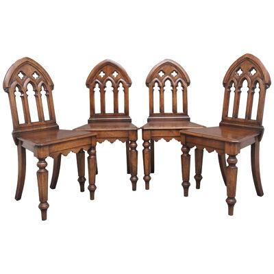 Set of four early 20th Century Gothic style hall chairs