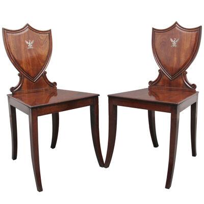 Pair of early 19th Century mahogany hall chairs