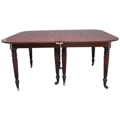 A large and impressive early 19th Century mahogany extending dining table