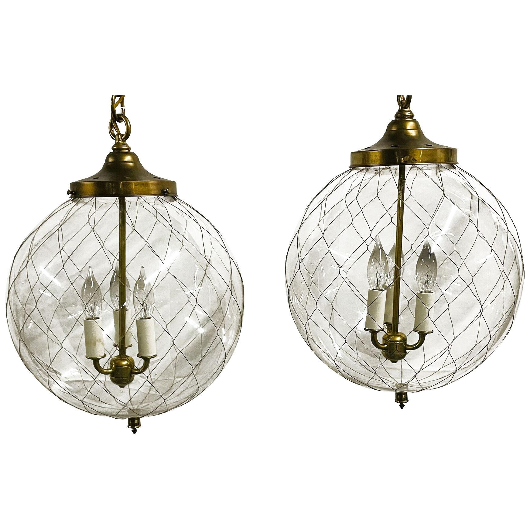 A Pair of Mid Century Modern Globe Pendants, Brass and Hand Blown Glass