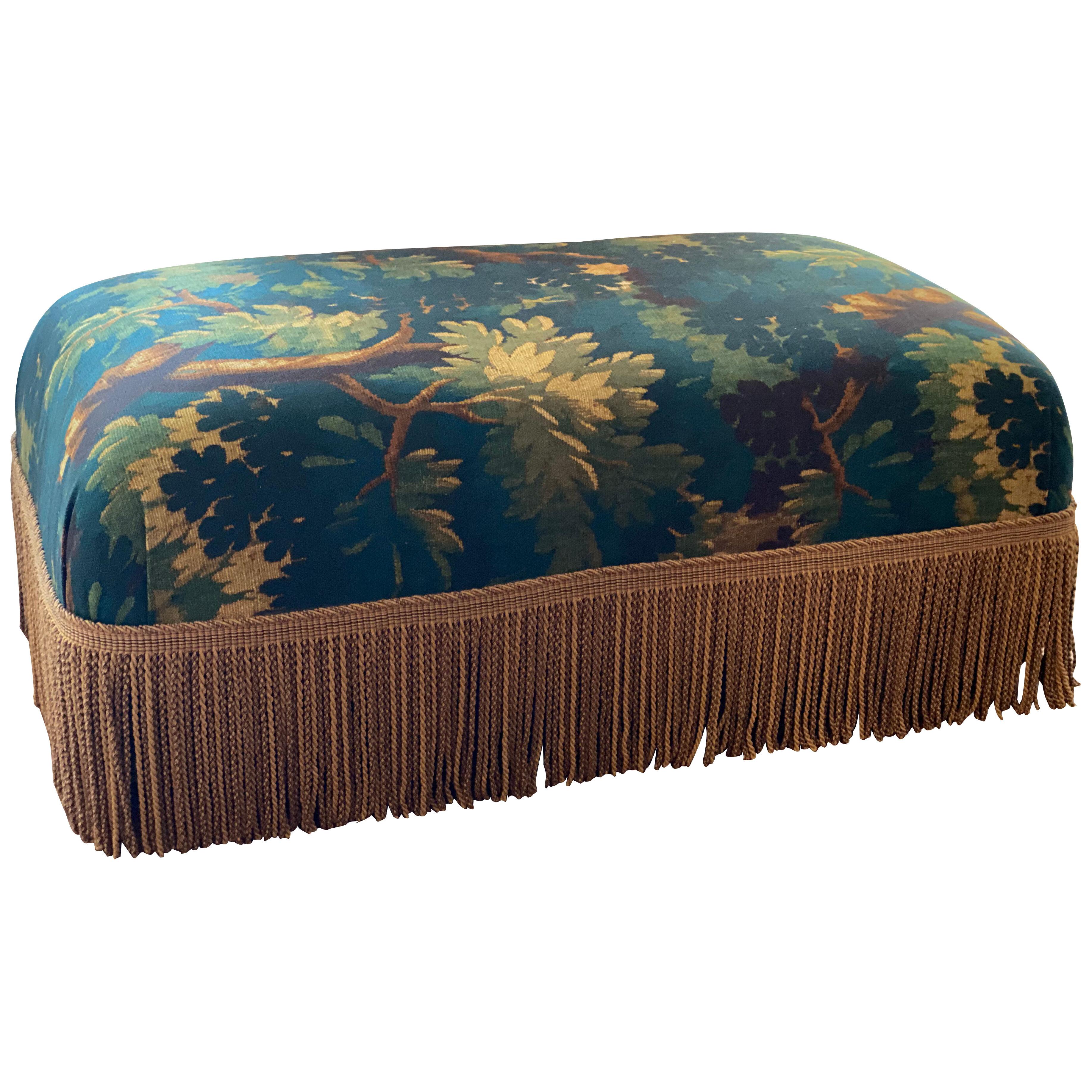 Pouf With Tapistery Upholstery and Gold Colored Frills