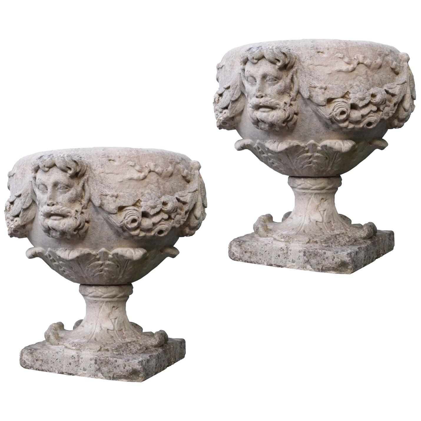 A Pair of 18th Century English Carved Limestone Urns