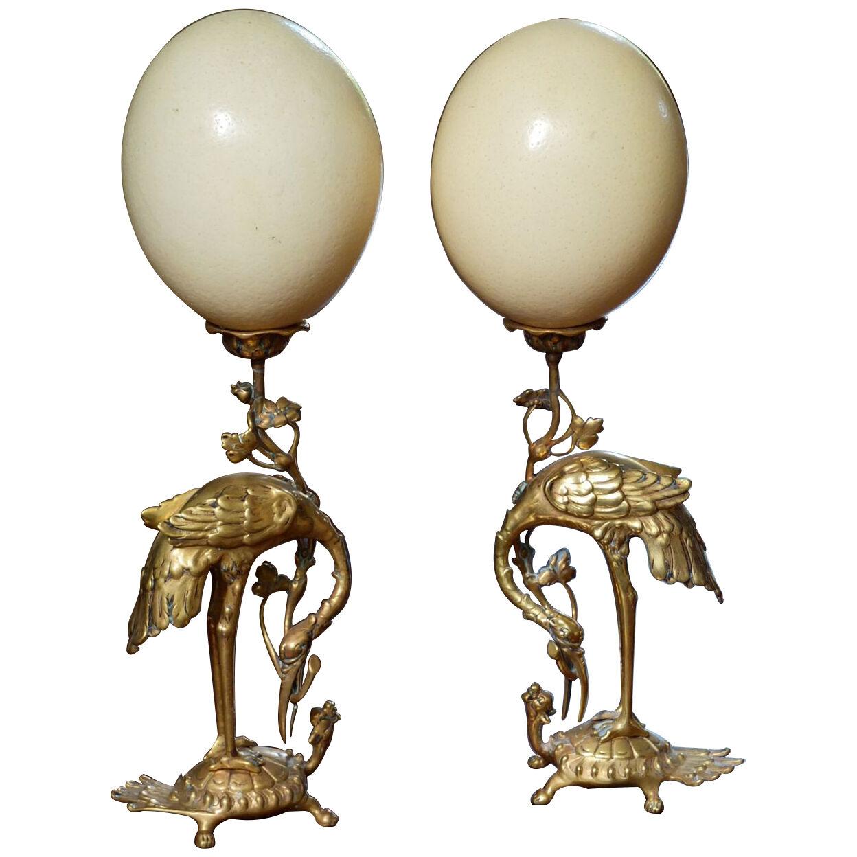 Pair of Ostrich eggs mounted on bronze .