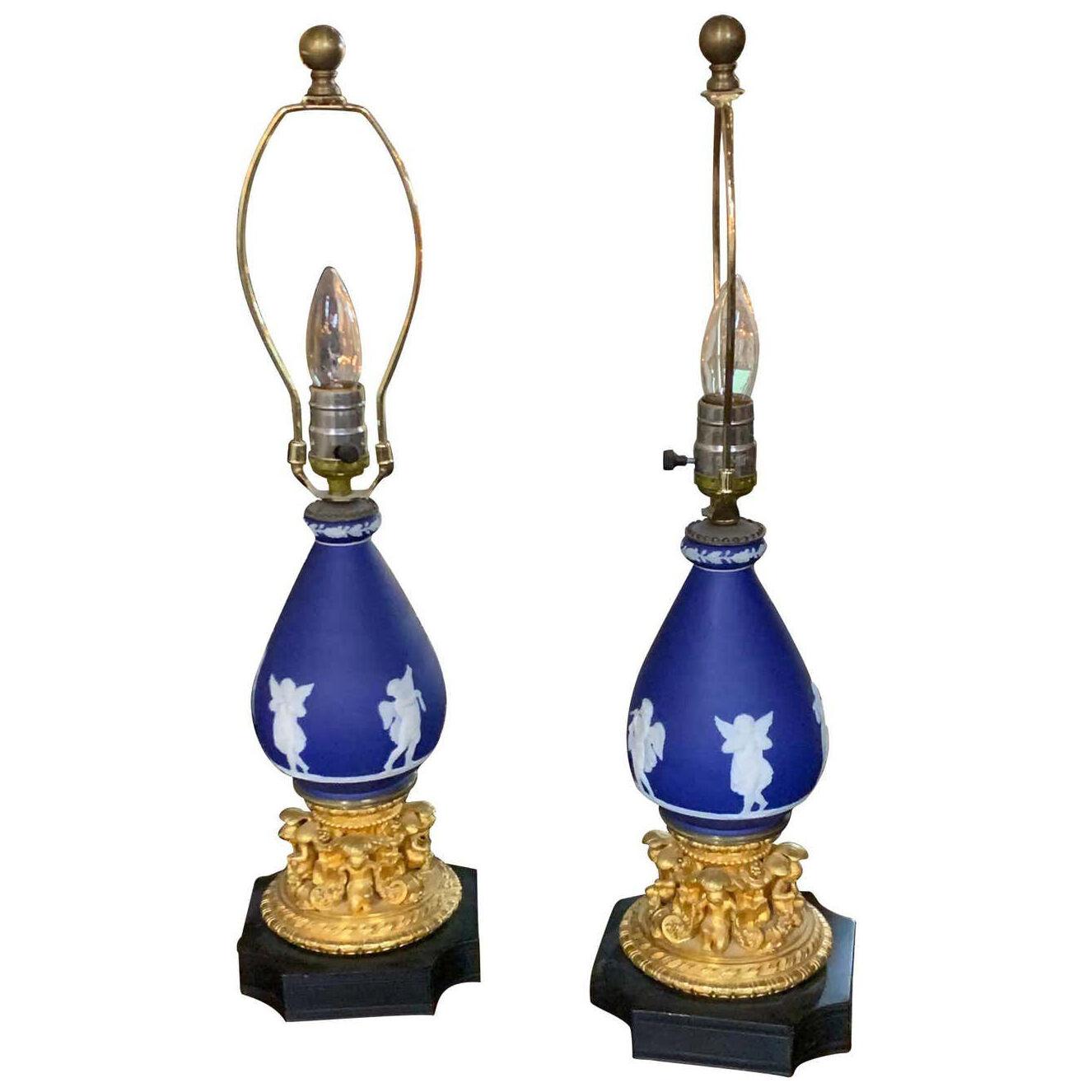 Pair of French Doré Bronze and Wedgewood Cherub Form Lamps