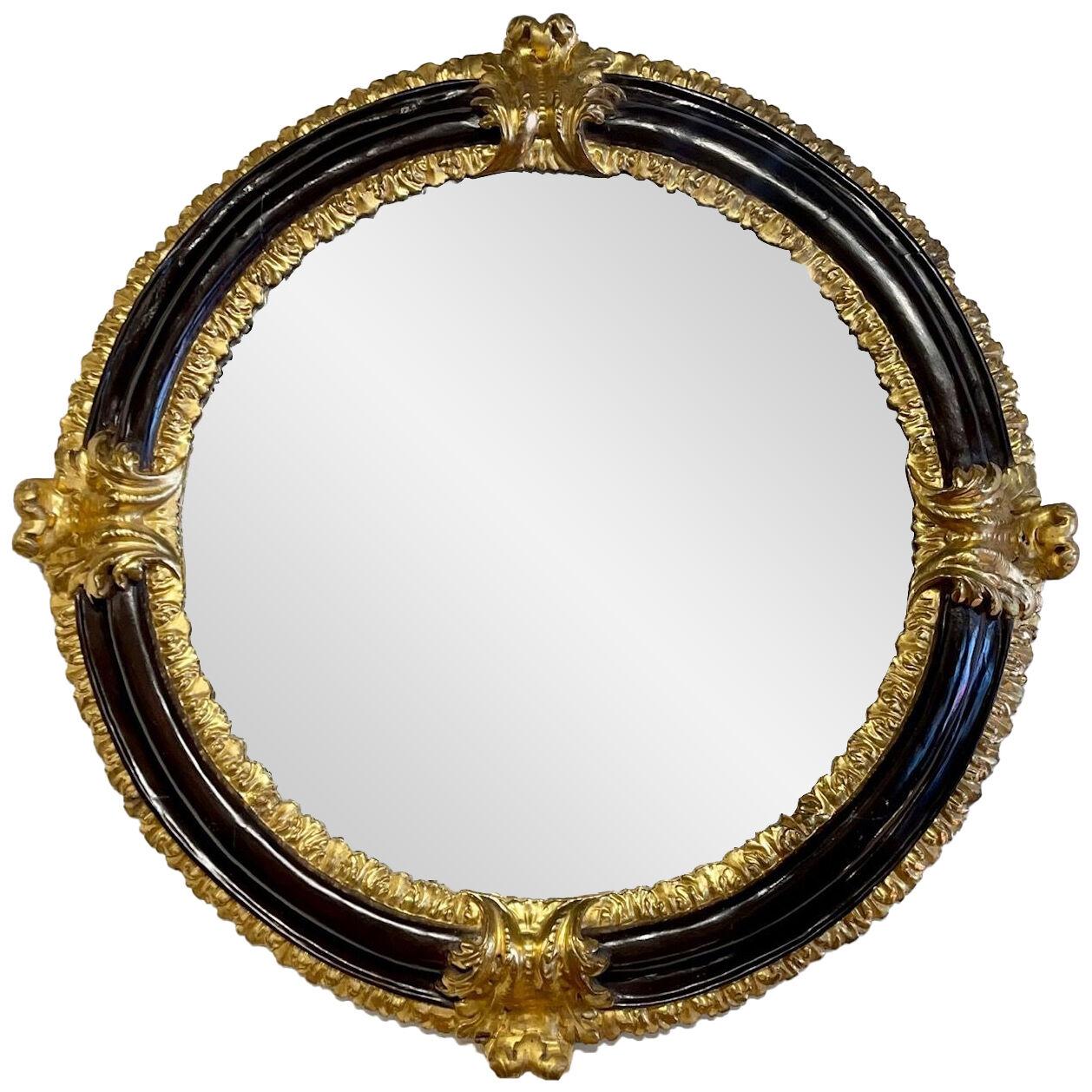 18th Century Italian Carved Wood Ebonized and Gilded Round Mirror