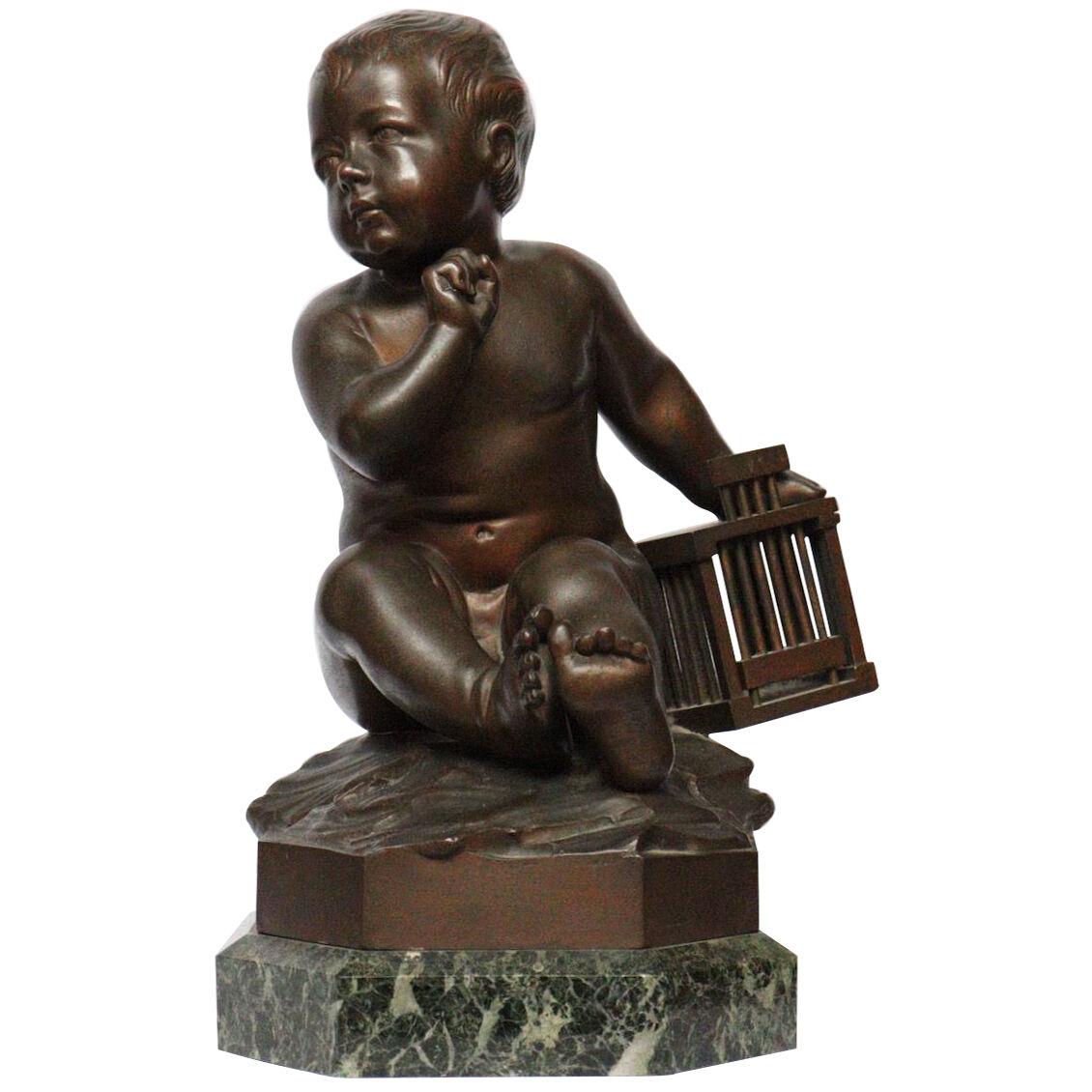 "L'Enfant à la Cage" A 19th Century Bronze Figure after Jean-Baptiste Pigalle