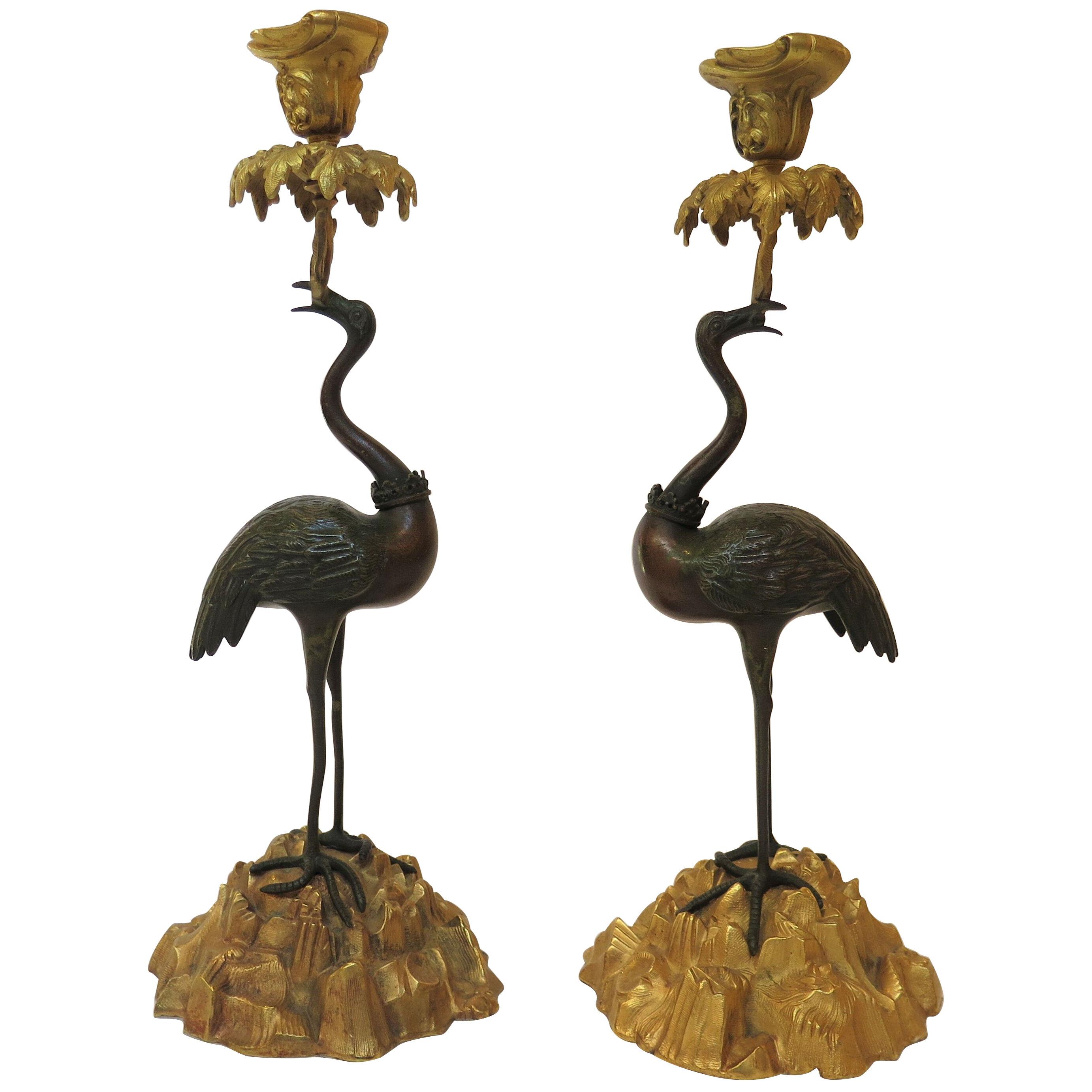 A Pair of 19th Century French Patinated And Gilt Bronze Crane Candlesticks 