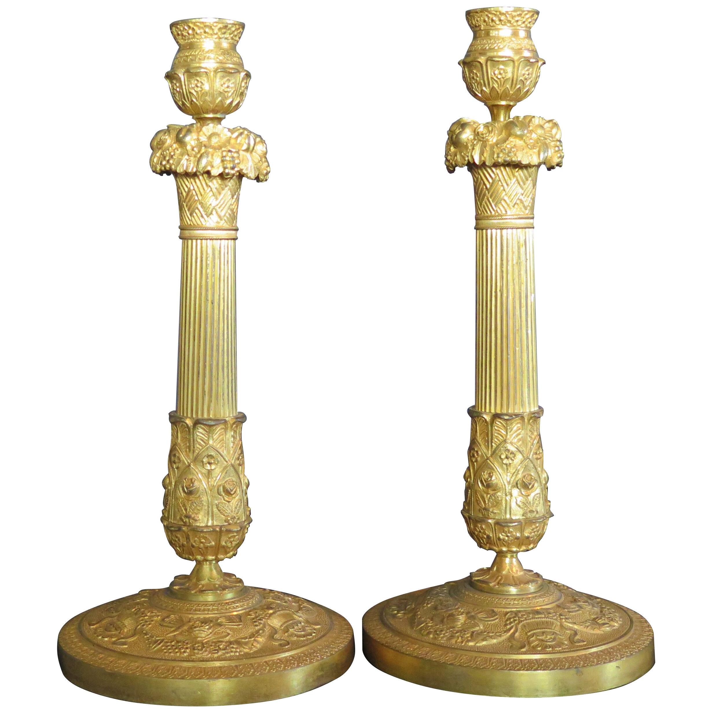 A Pair of French Empire Gilt Bronze Candlesticks