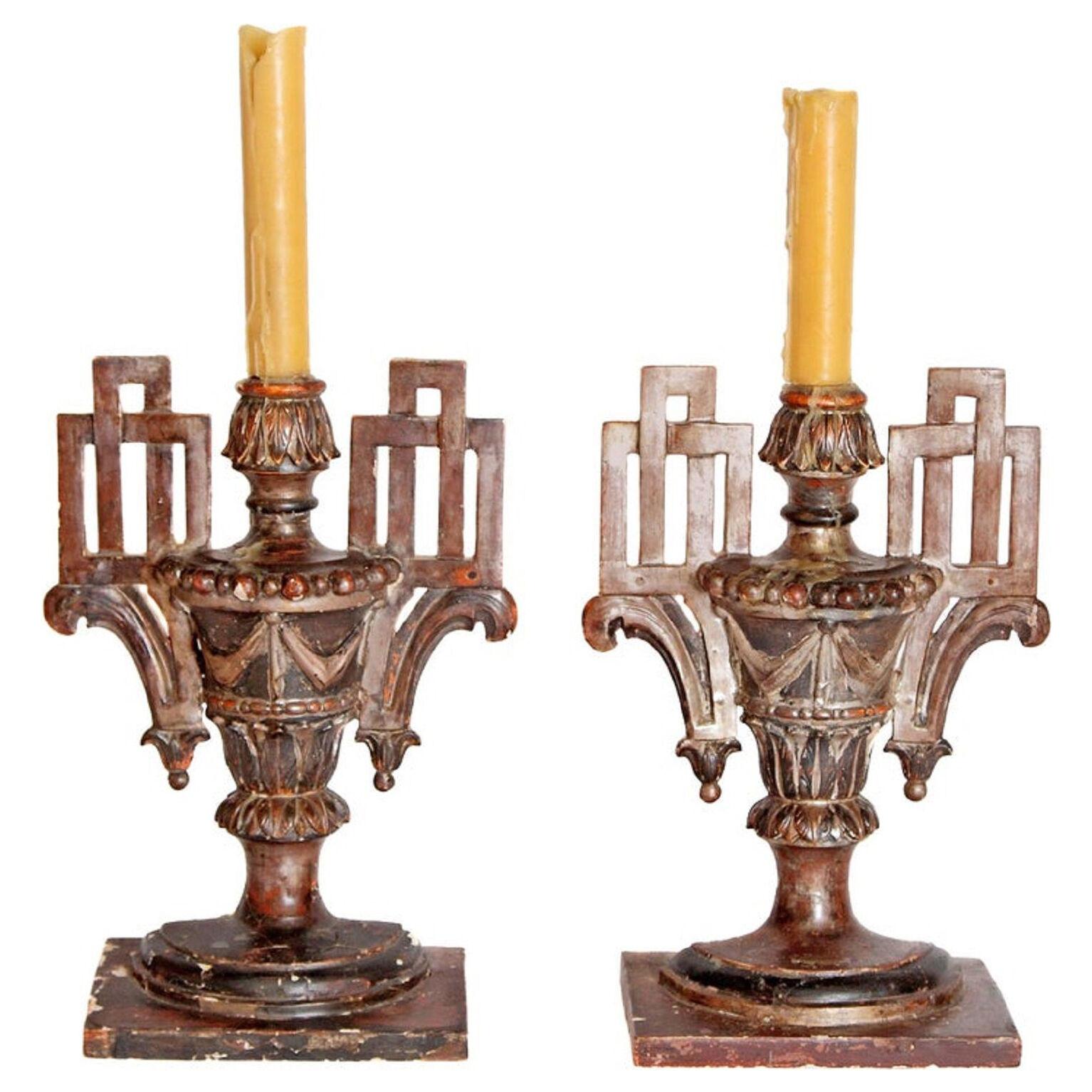A Pair of Italian Neoclassical Carved Candleholders