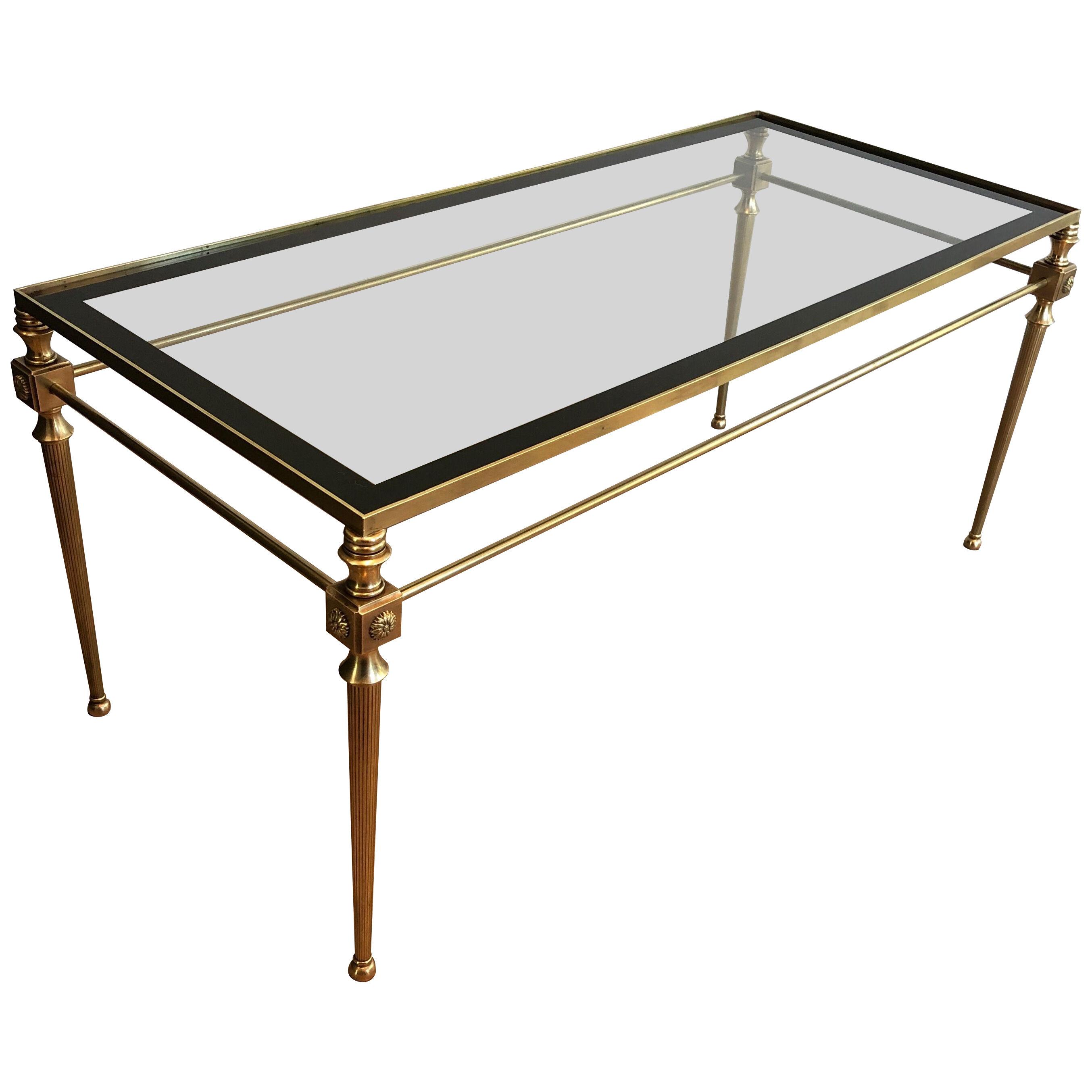 Brass Coffee Table with Glass Top Surrounded by Black Lacquered Line