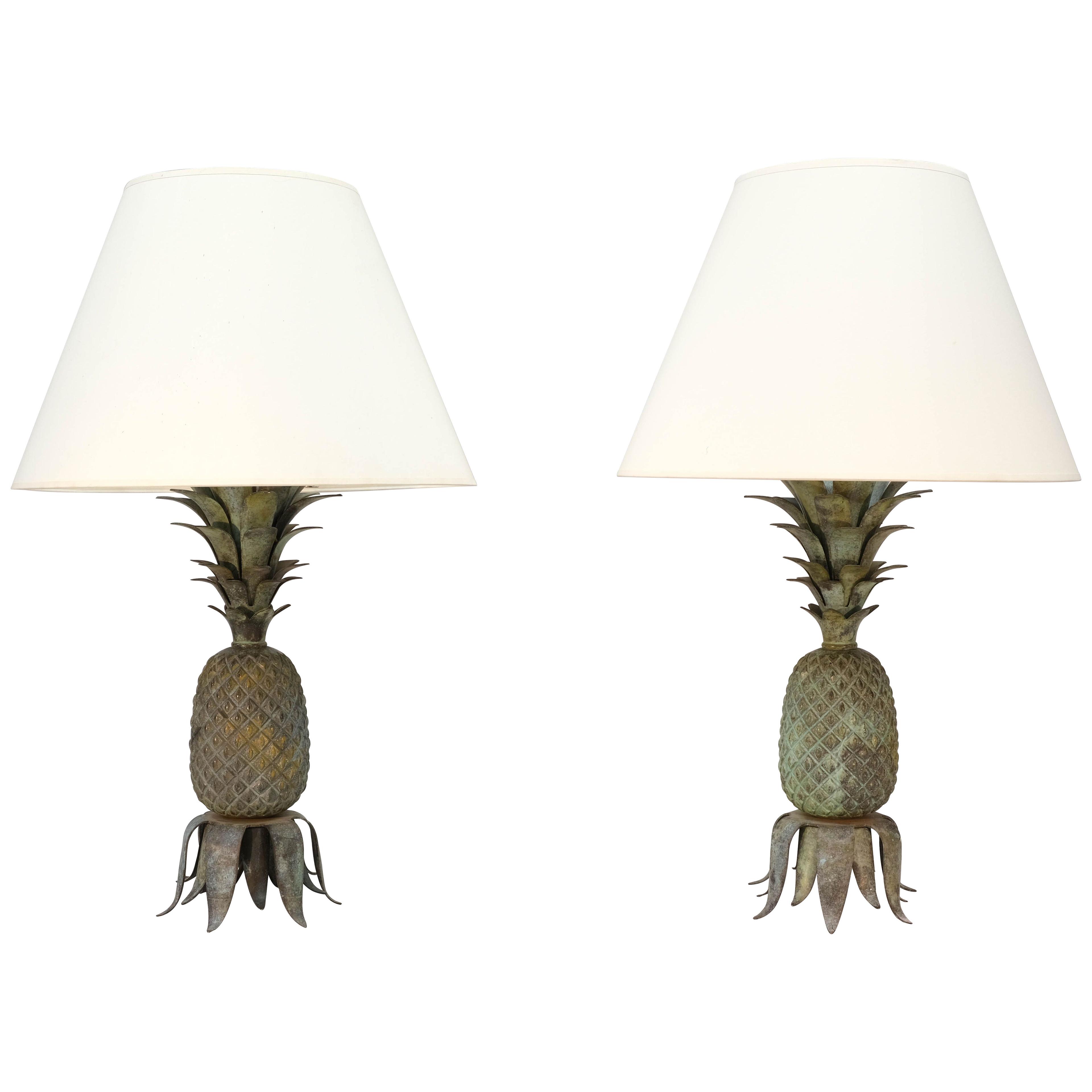A pair of mid 20th century bronze lamps in the form of pineapples. 