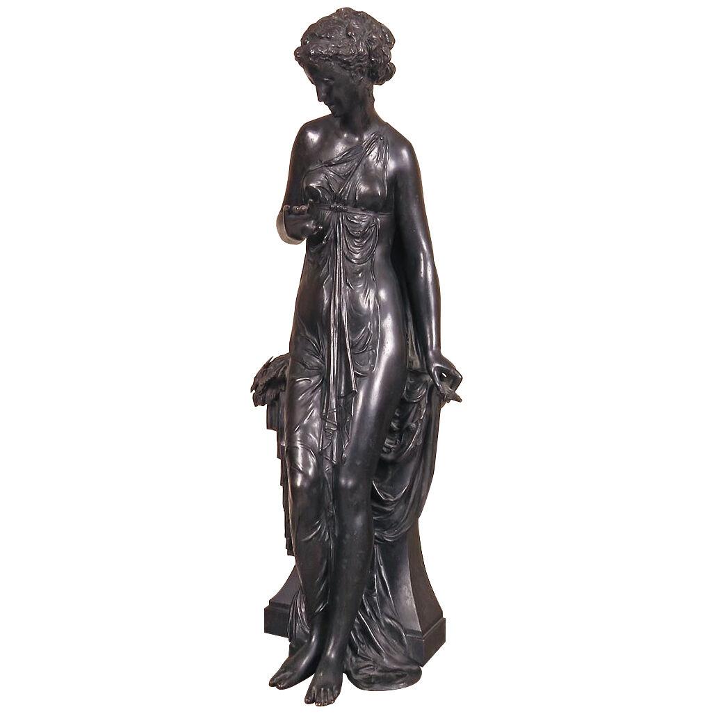 A pair of 19th century bronze French Neoclassical female figures. 
