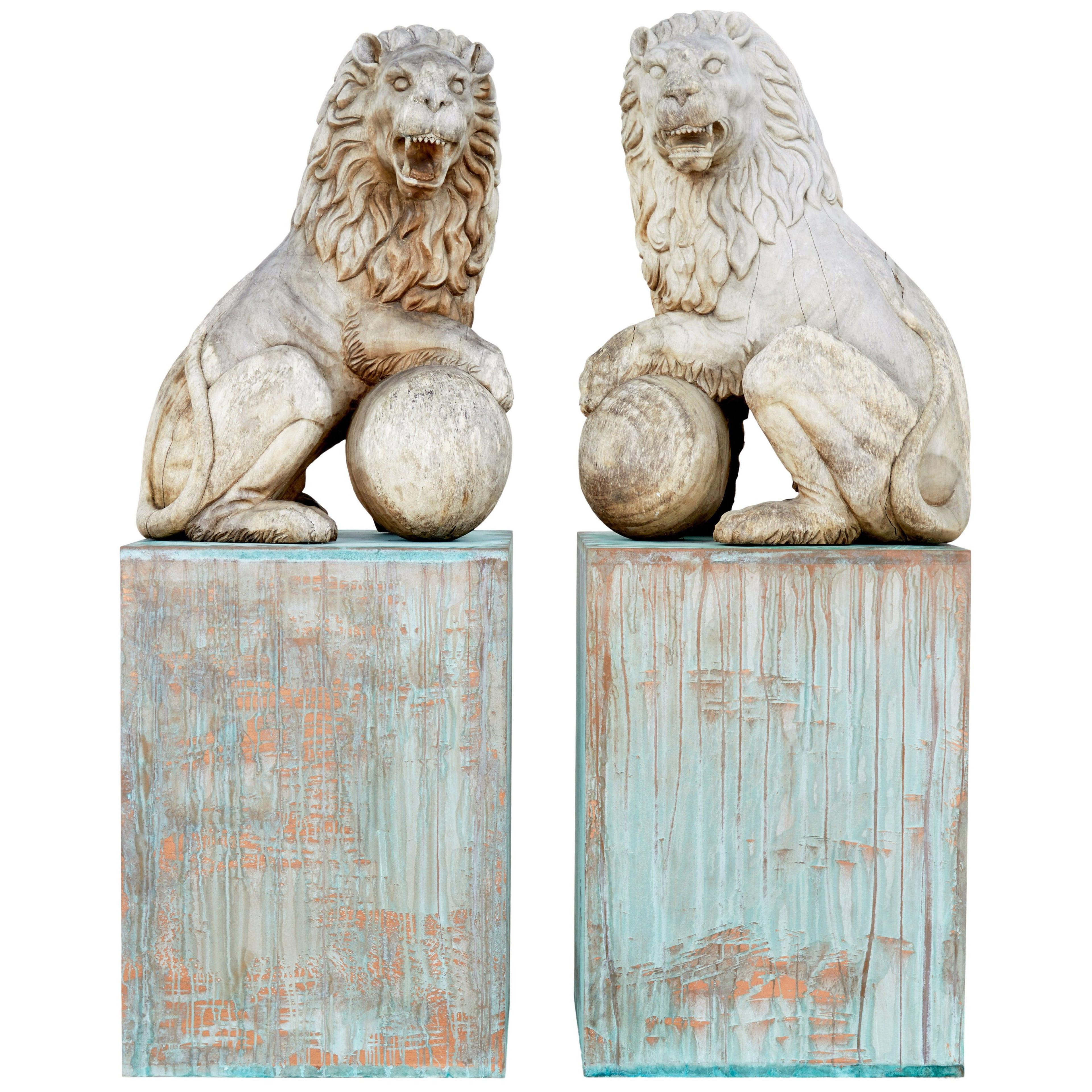 PAIR OF MID 20TH CENTURY CARVED SOLID WOOD LIONS