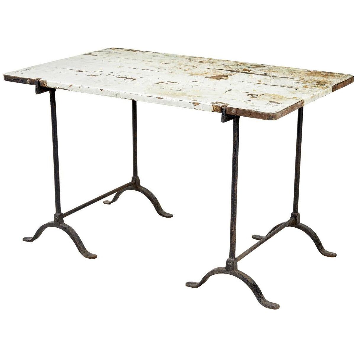 EARLY 20TH CENTURY PINE AND IRON TRESTLE WORK TABLE