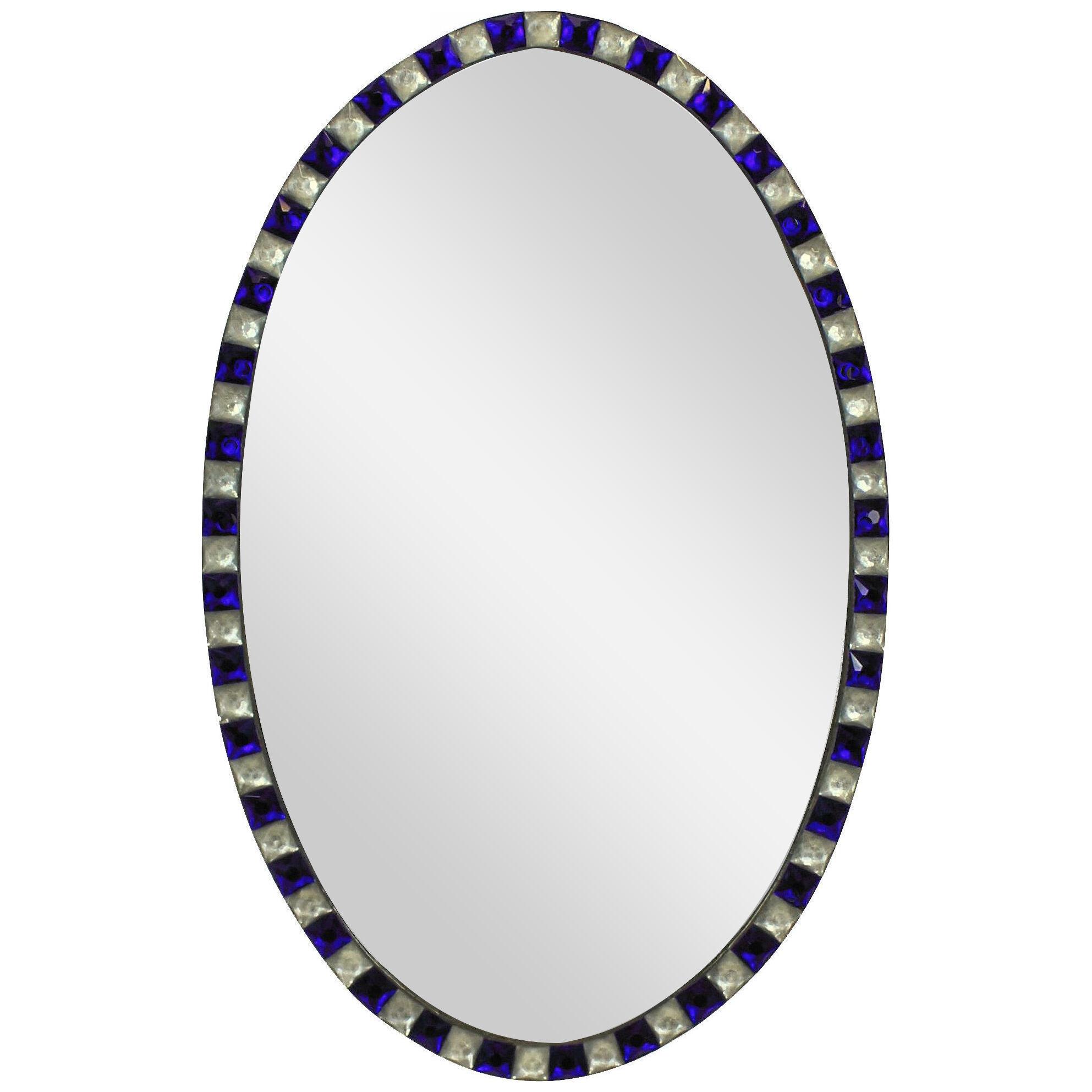 A GEORGIAN STYLE IRISH MIRROR WITH BLUE GLASS & ROCK CRYSTAL FACETED BORDER