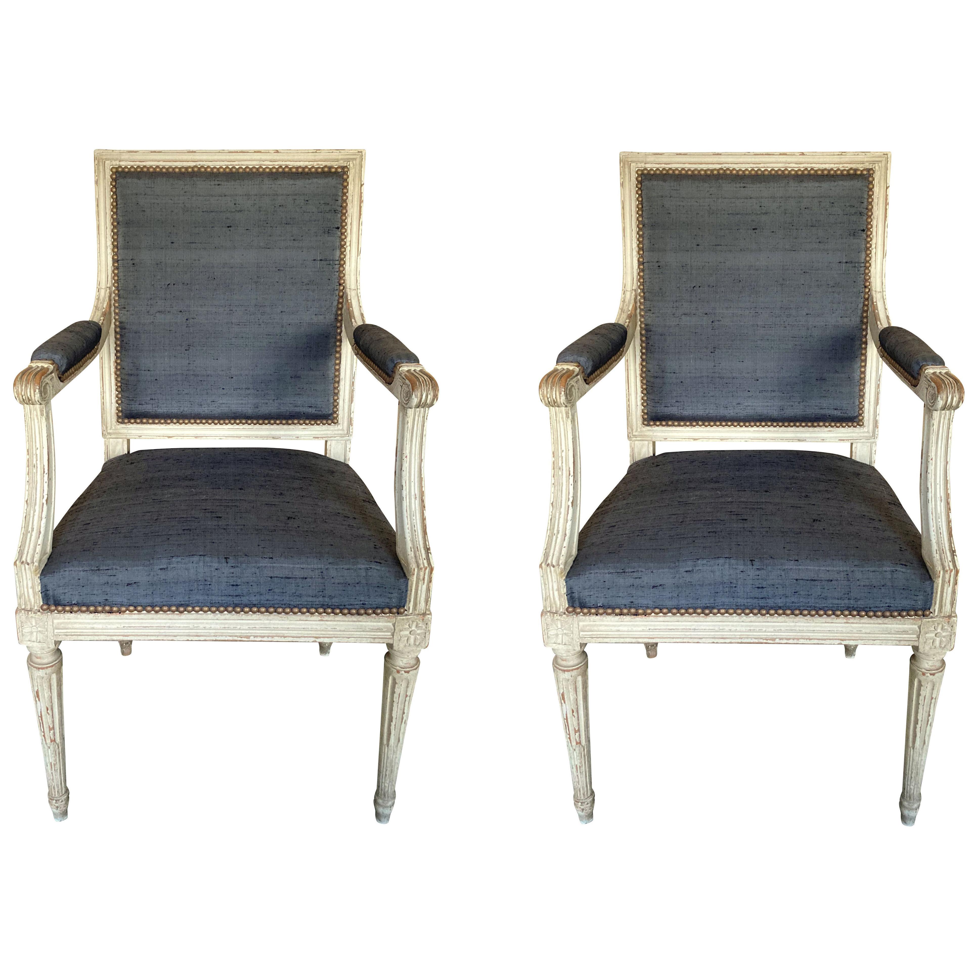 A PAIR OF PAINTED LOUIS XVI STYLE ARMCHAIRS IN CHARCOAL SILK