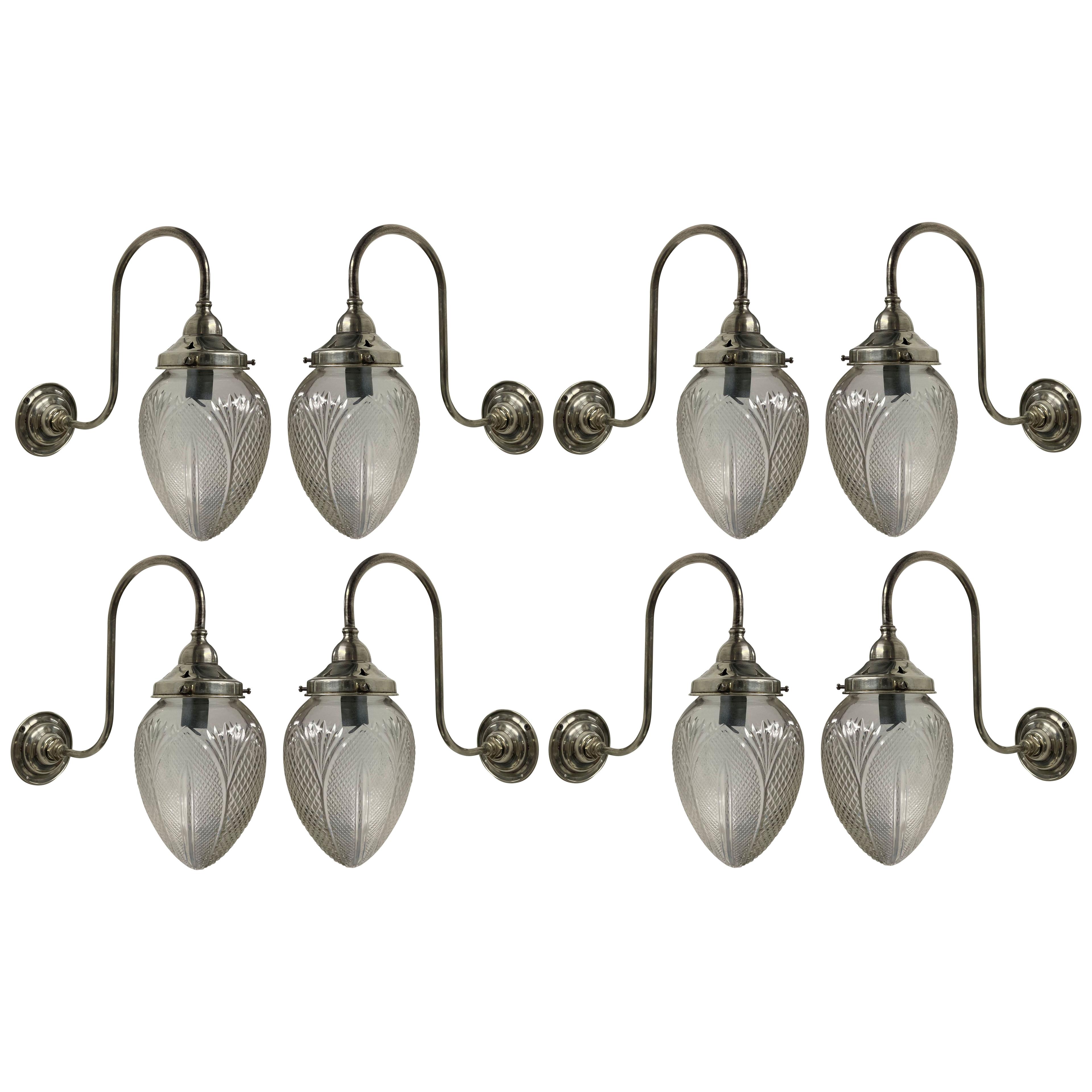 A SET OF EIGHT EDWARDIAN SILVER SWAN NECK WALL LIGHTS