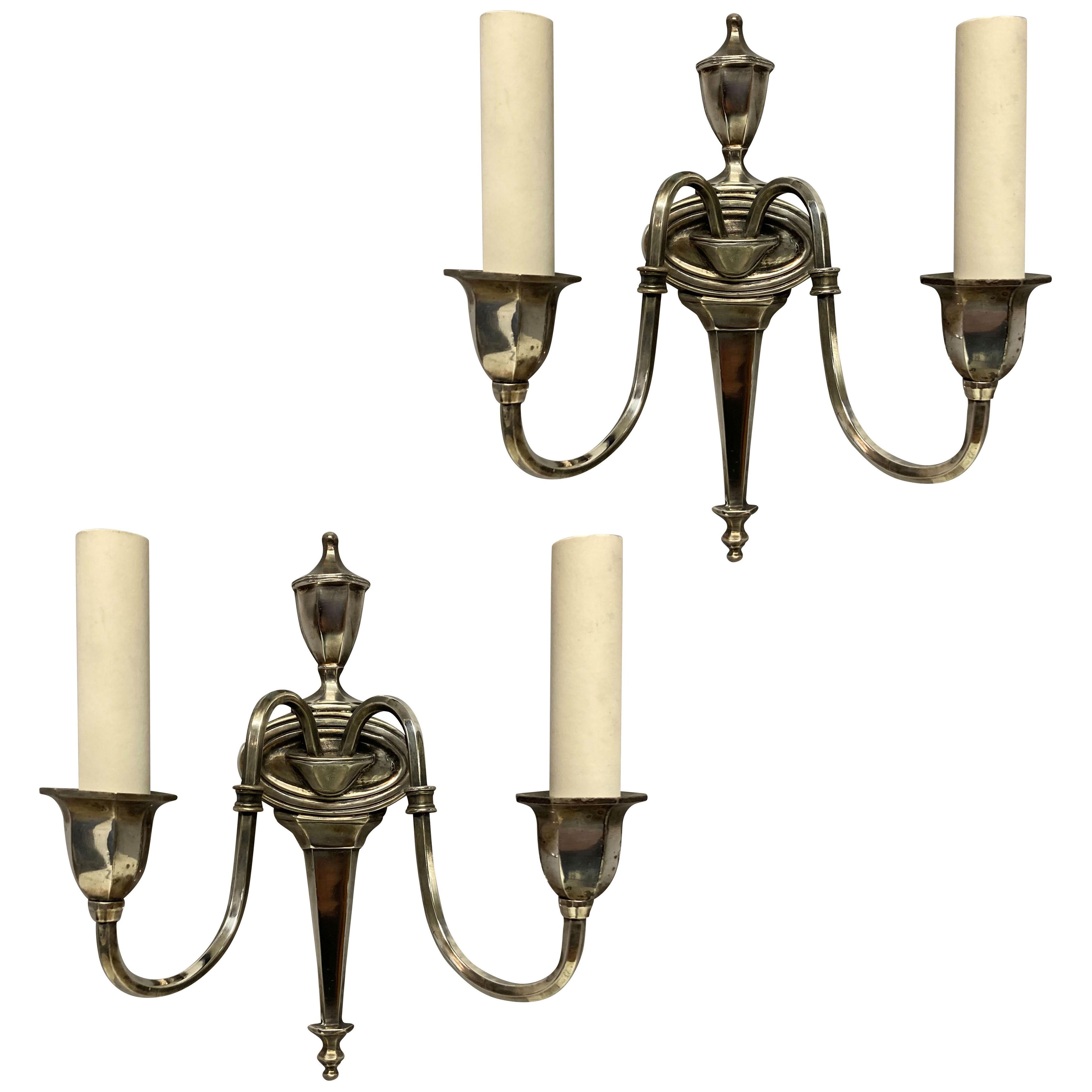 A PAIR OF FRENCH SILVER PLATED TWIN BRANCH WALL LIGHTS