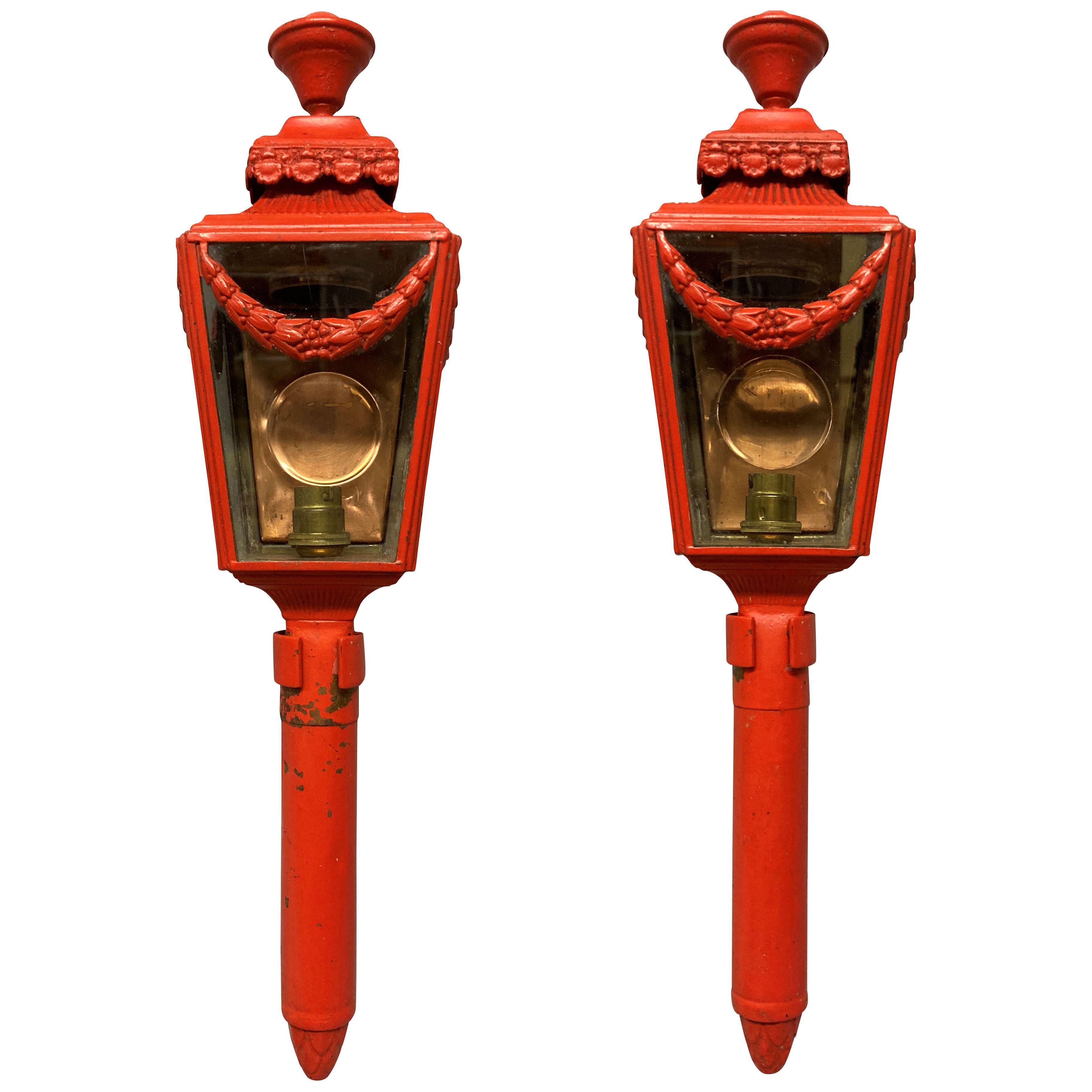 A PAIR OF ENGLISH SCARLET PAINTED WALL LANTERNS