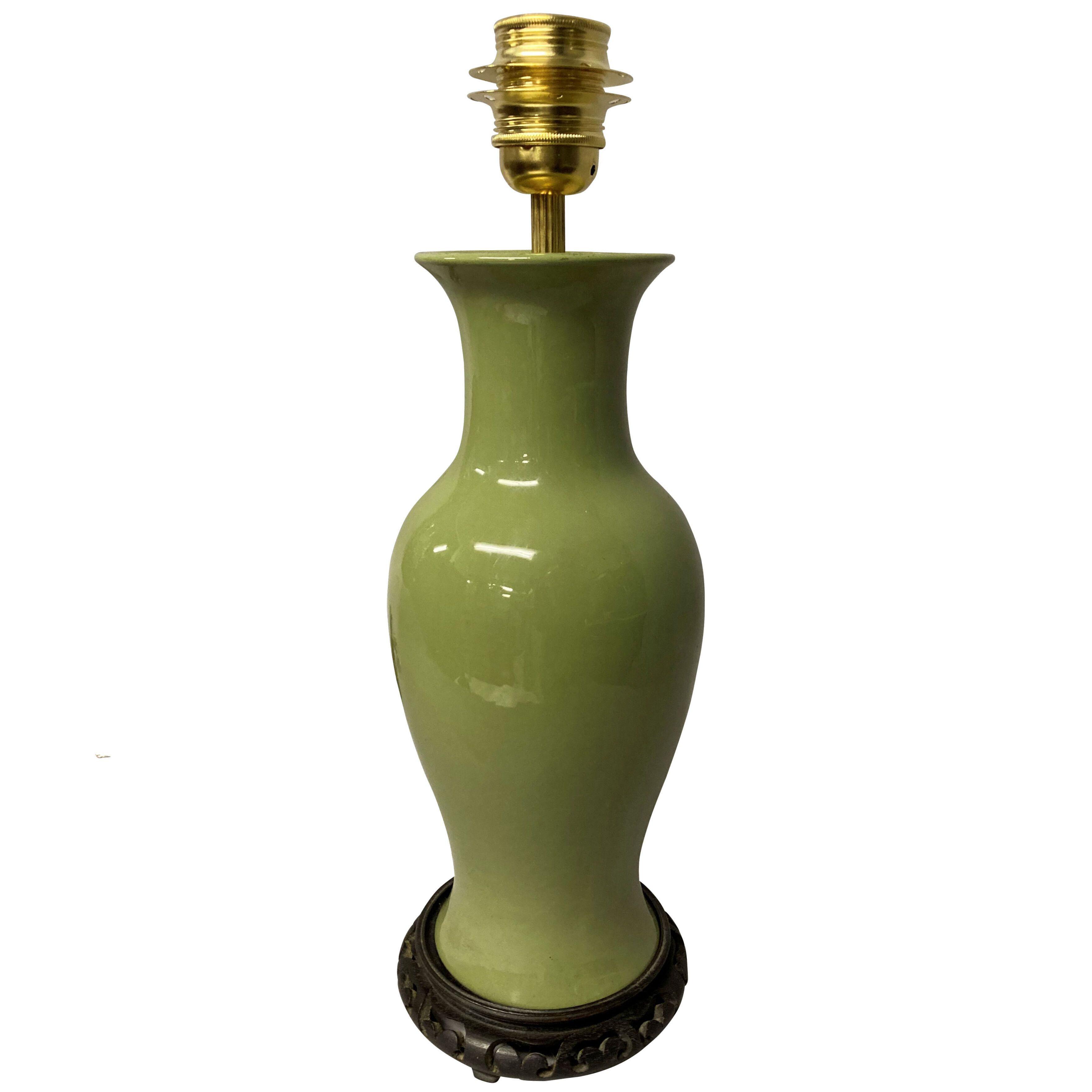 A CHINESE GREEN GLAZED PORCELAIN LAMP