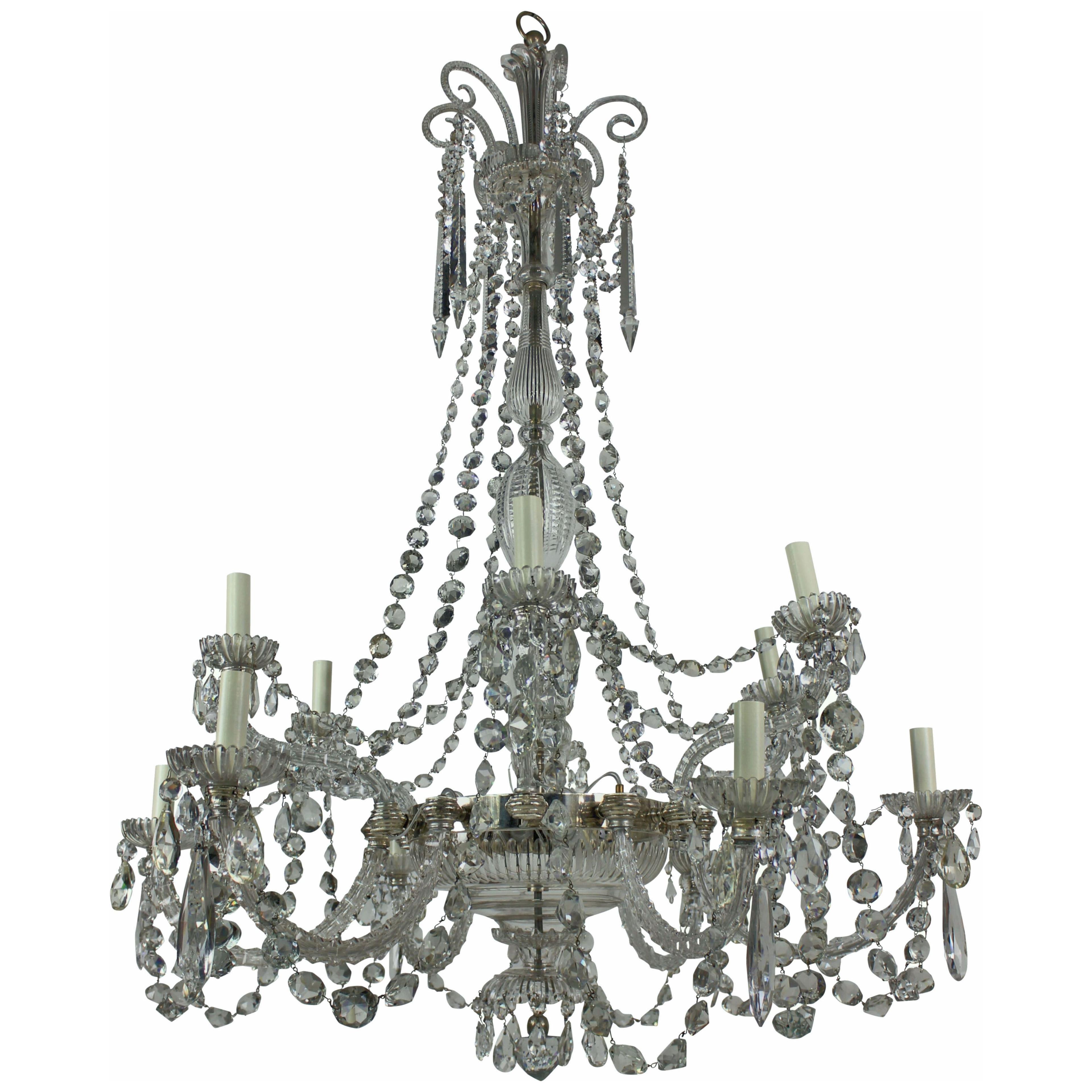 A LARGE ENGLISH TWELVE LIGHT CUT GLASS CHANDELIER BY PERRY OF FINE QUALITY