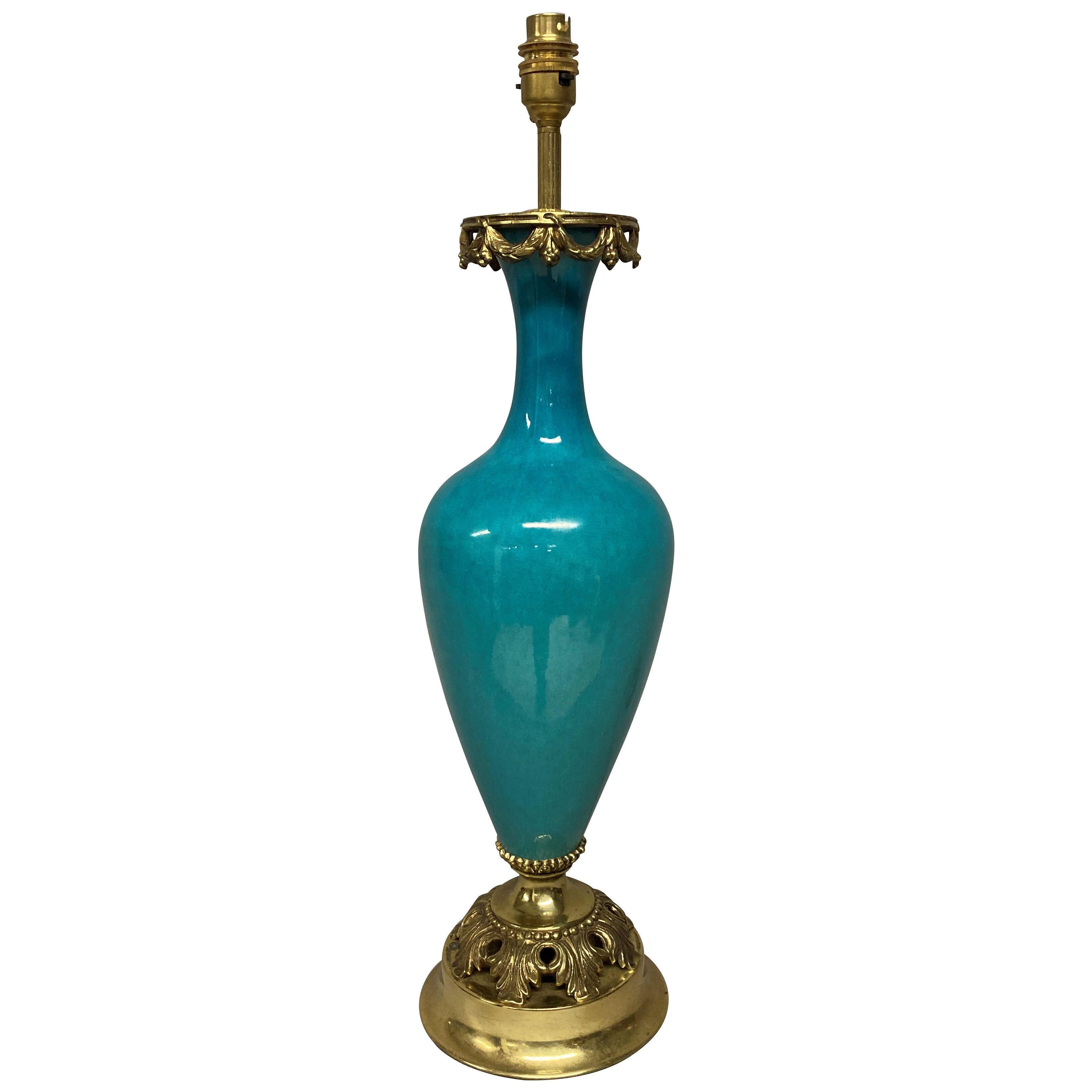A FRENCH TURQUOISE GLAZED PORCELAIN & GILT MOUNTED LAMP