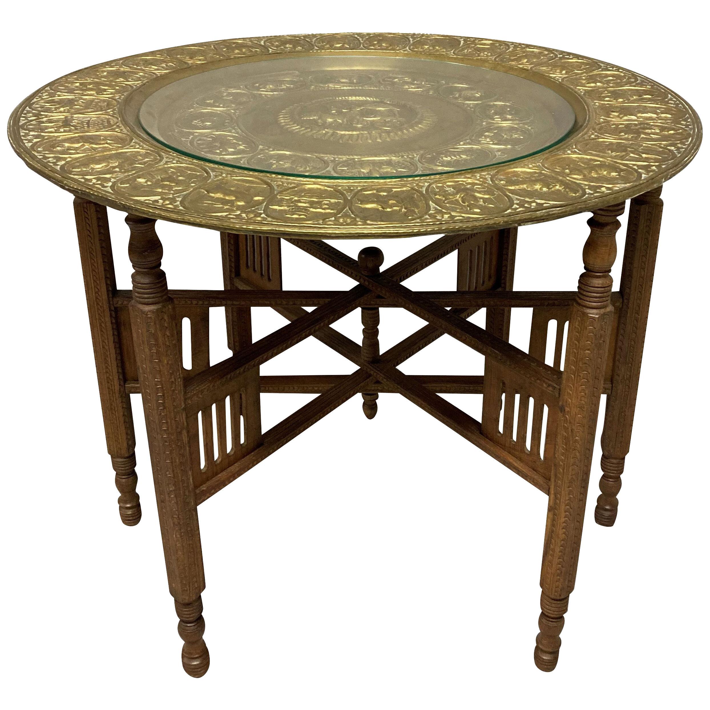 AN INDIAN BRASS FOLDING OCCASIONAL TABLE