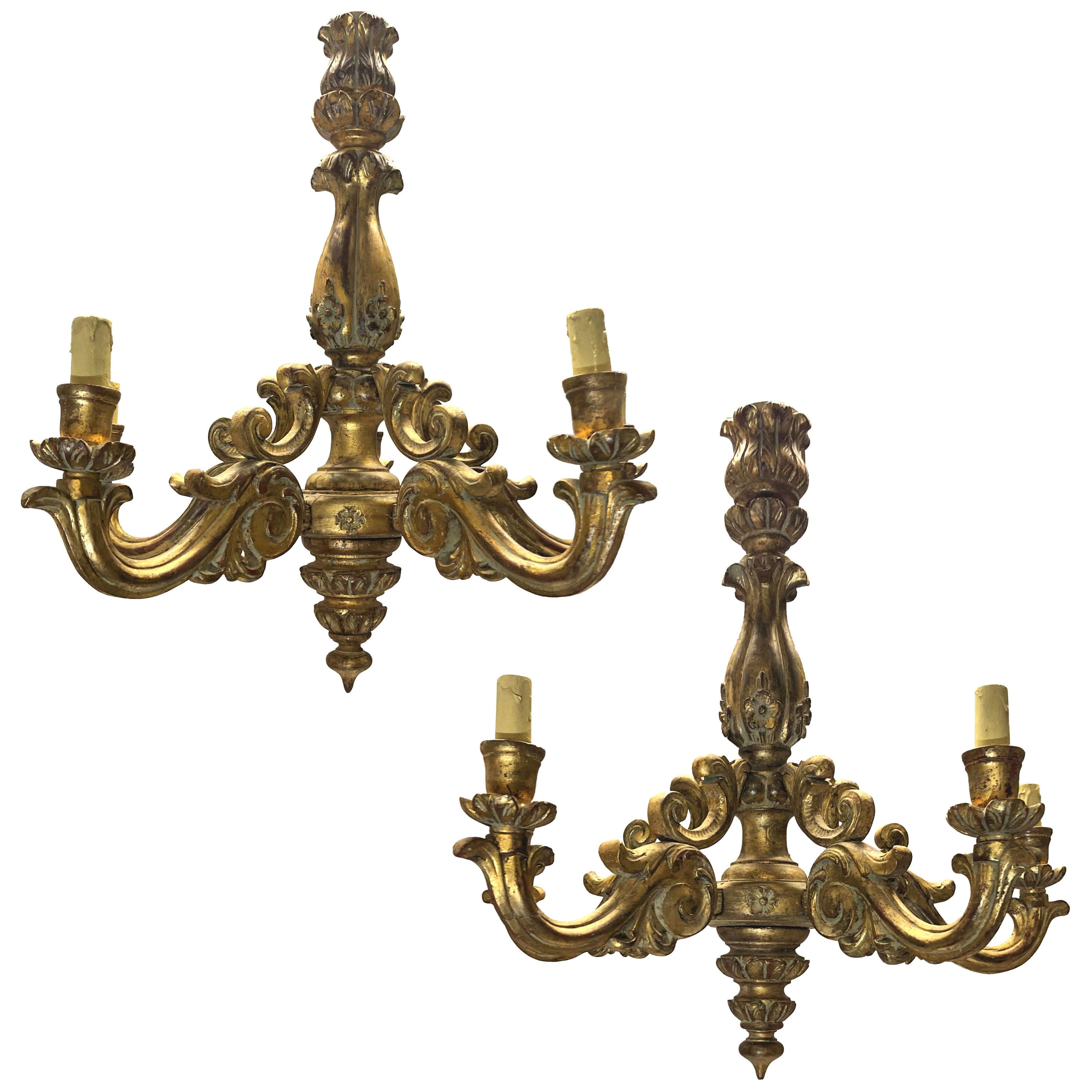 A PAIR OF ITALIAN FIVE BRANCH GILT WOOD CHANDELIERS