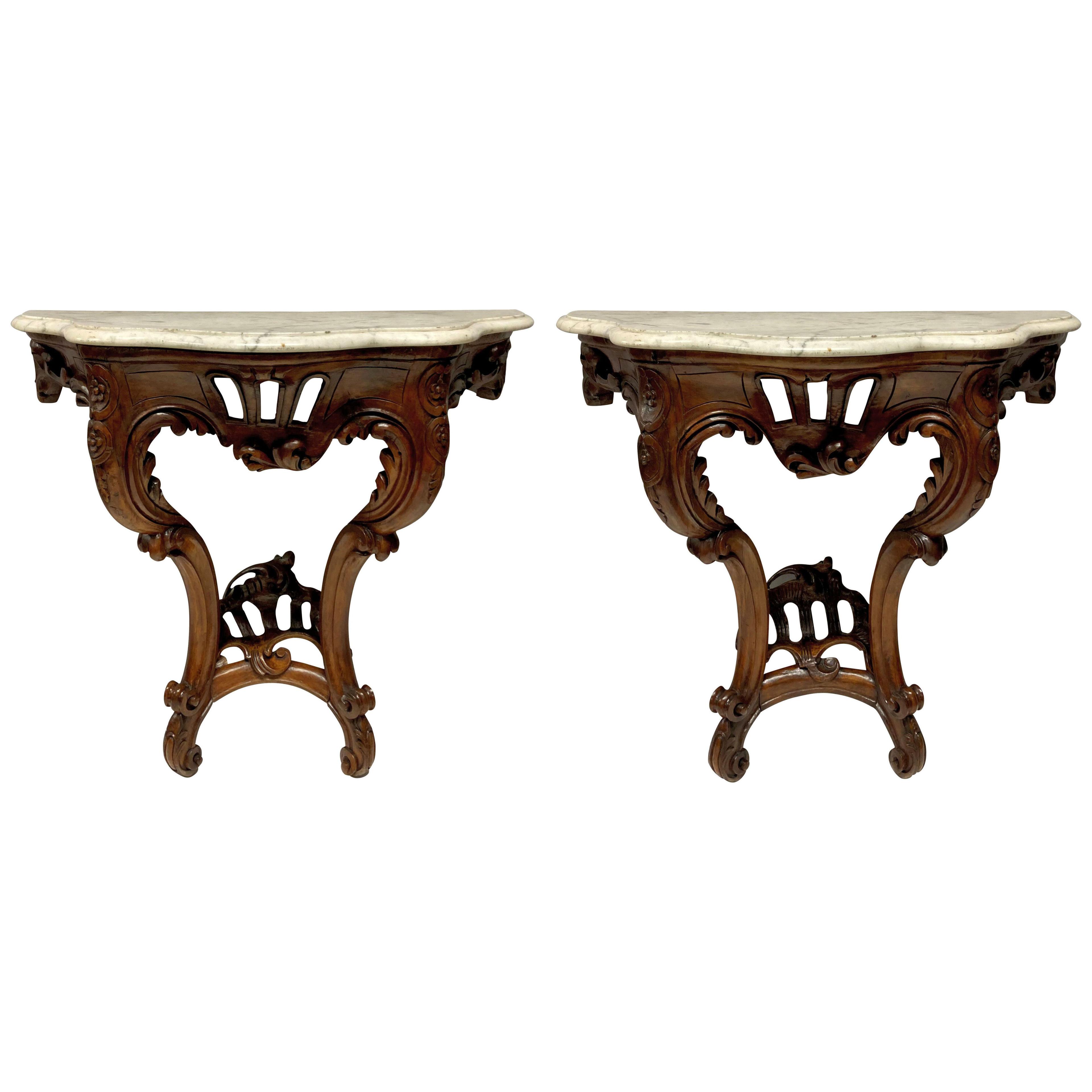 A PAIR OF LOUIS XV STYLE WALNUT & MARBLE CONSOLE TABLES