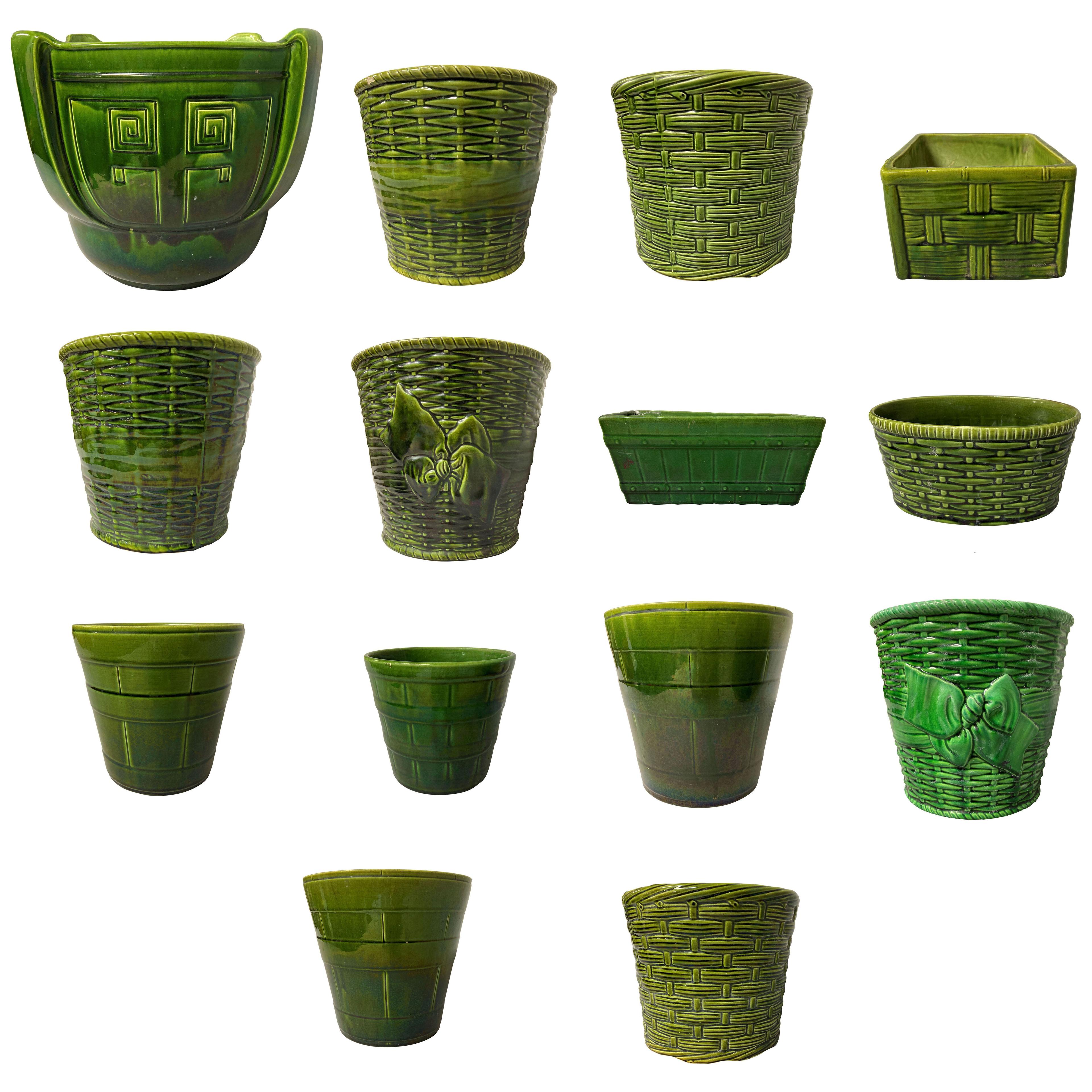 A COLLECTION OF FOURTEEN ENGLISH BRETBY & OTHER EMERALD GREEN CACHE POT