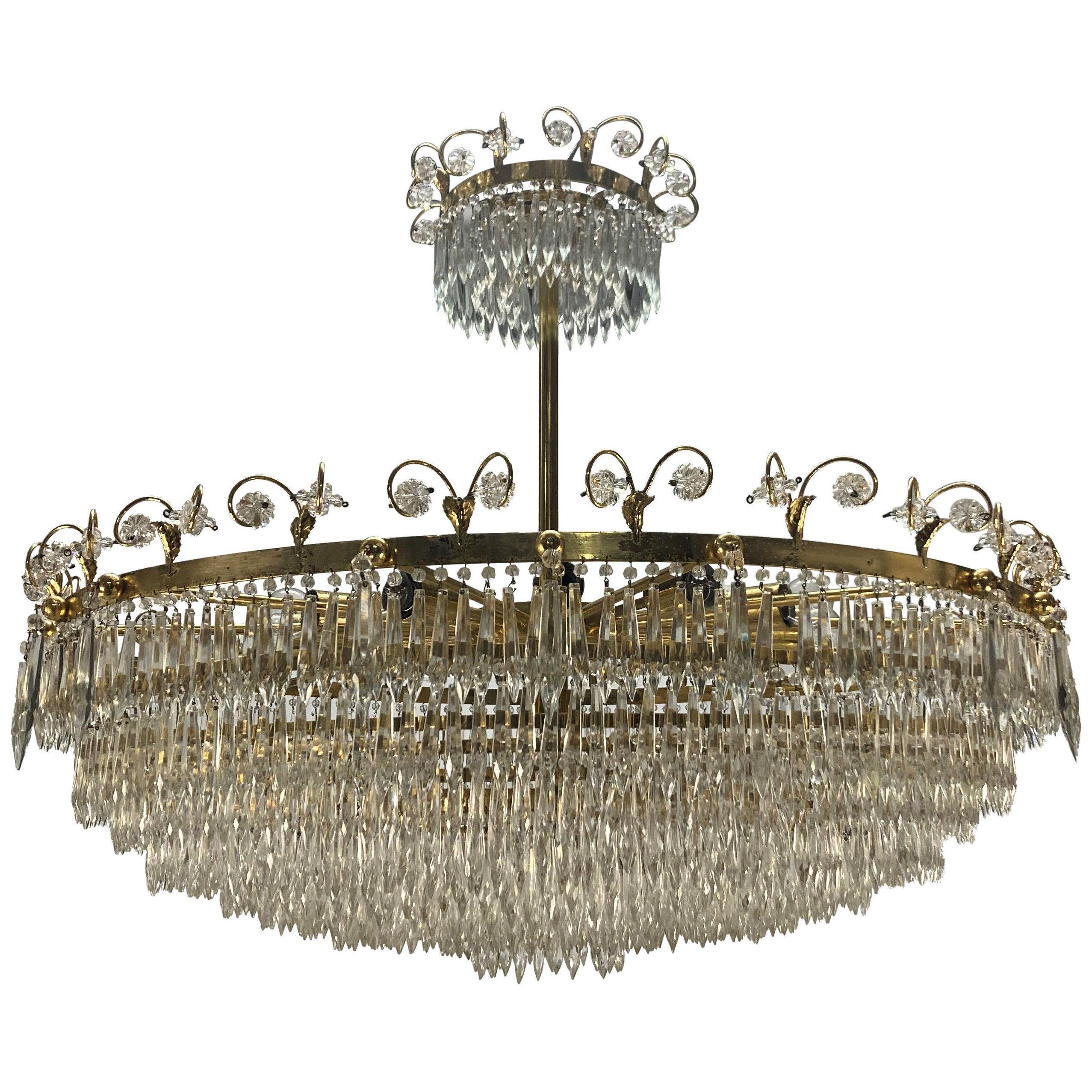 A LARGE MID-CENTURY CIRCULAR GRADUATED WATERFALL CHANDELIER