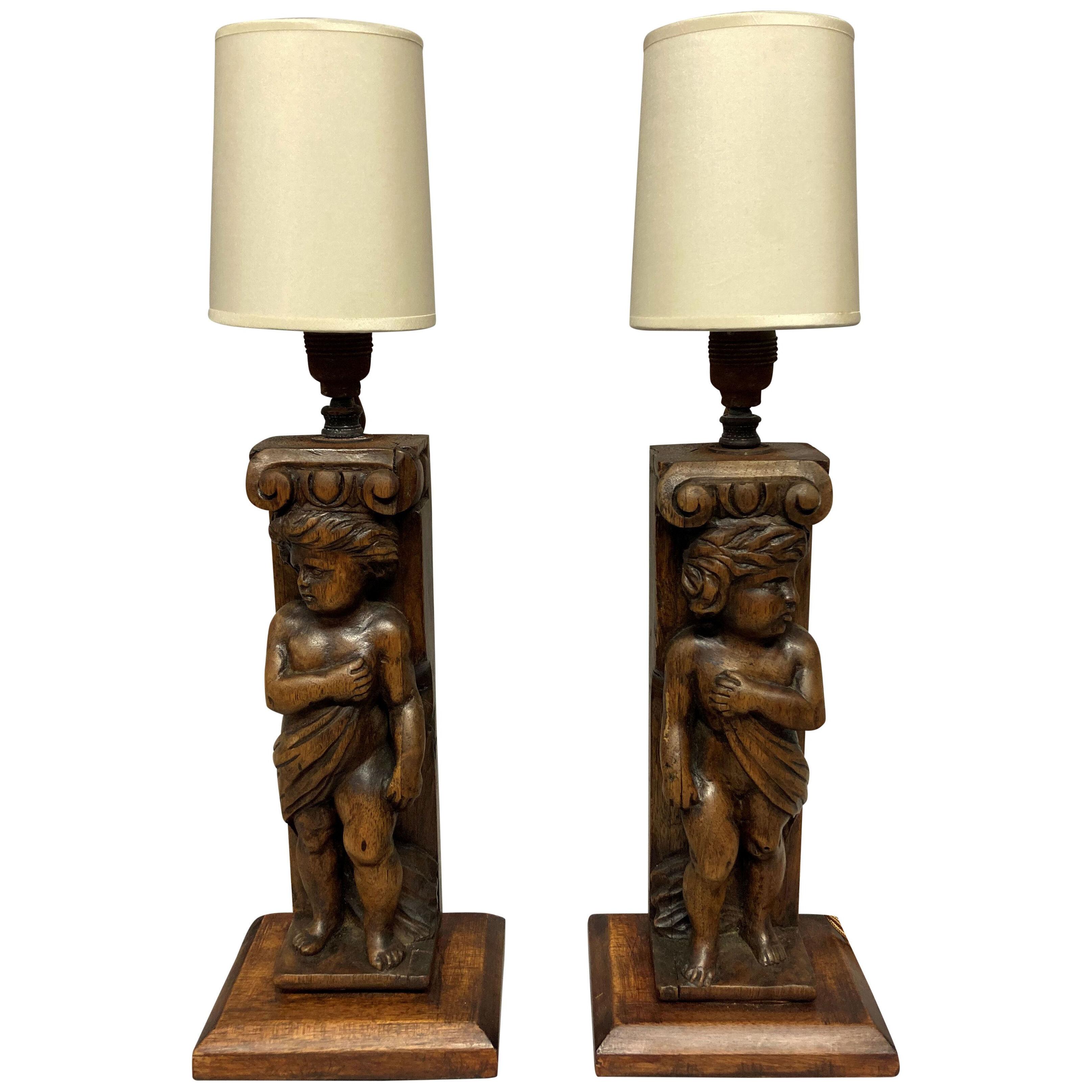 A PAIR OF ENGLISH CARVED WALNUT LAMPS