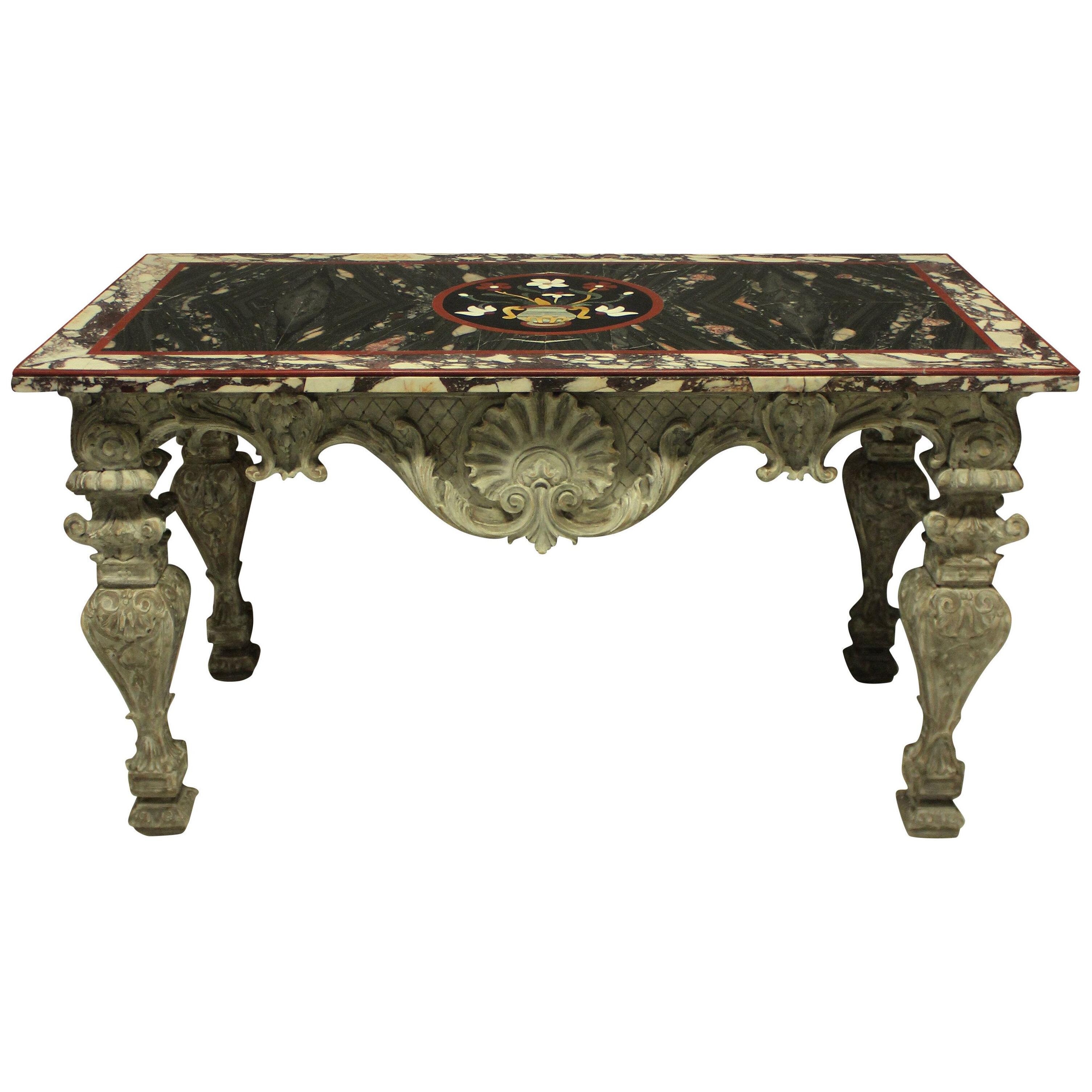 AN ITALIAN BAROQUE CARVED & PAINTED PIETRA DURA CENTRE TABLE