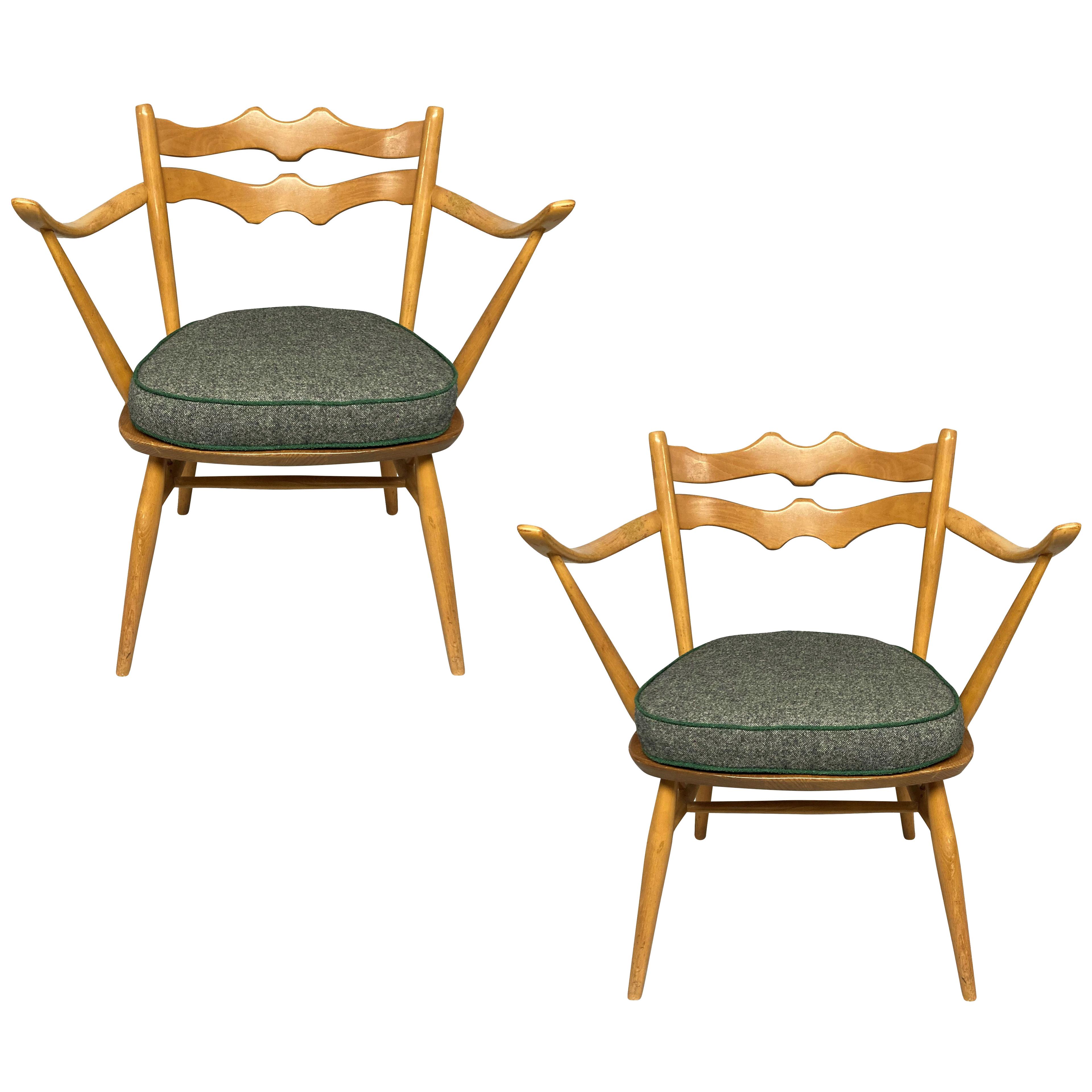 A PAIR OF ENGLISH MID-CENTURY ARMCHAIRS