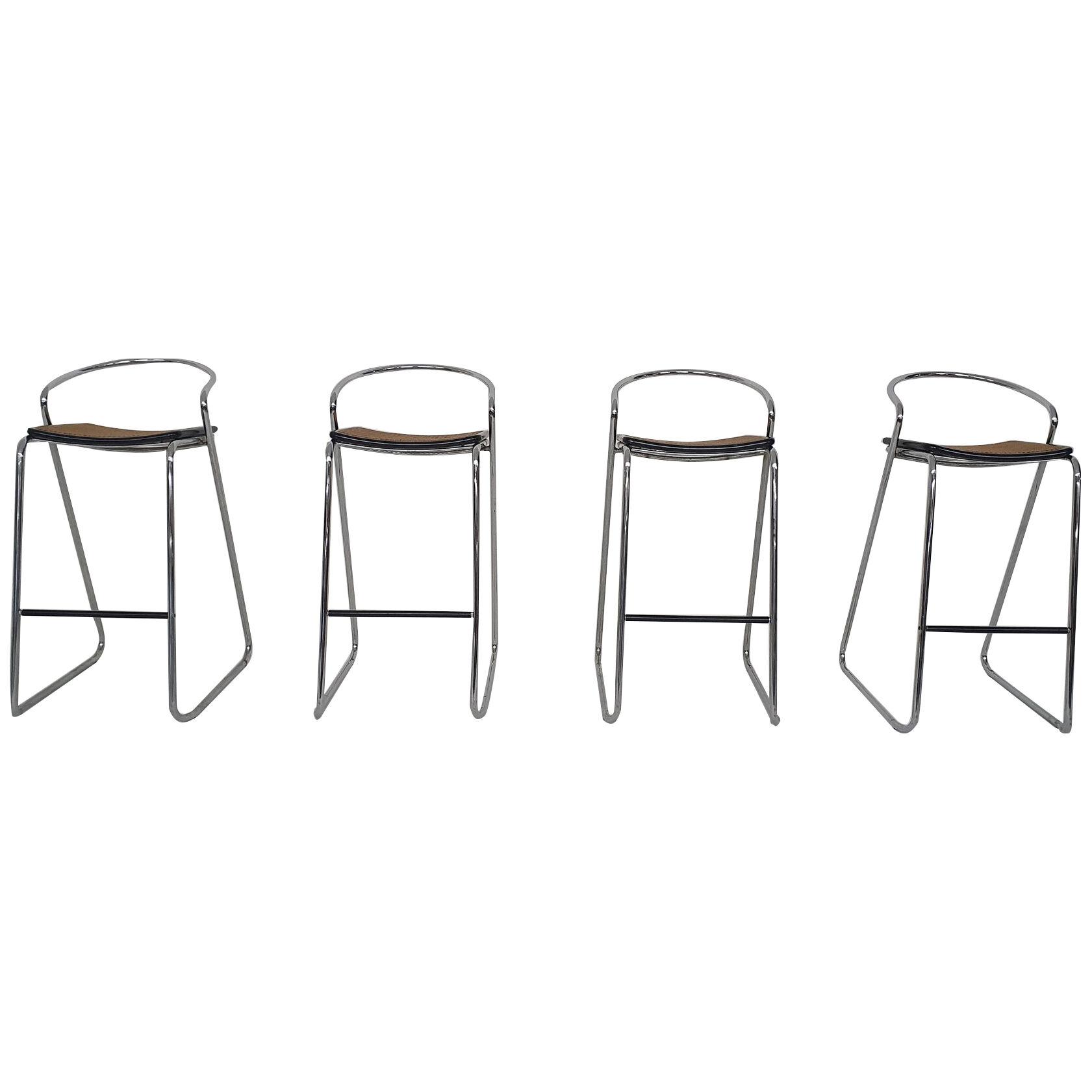 Set of four chrome and cane bar stools, 1970's