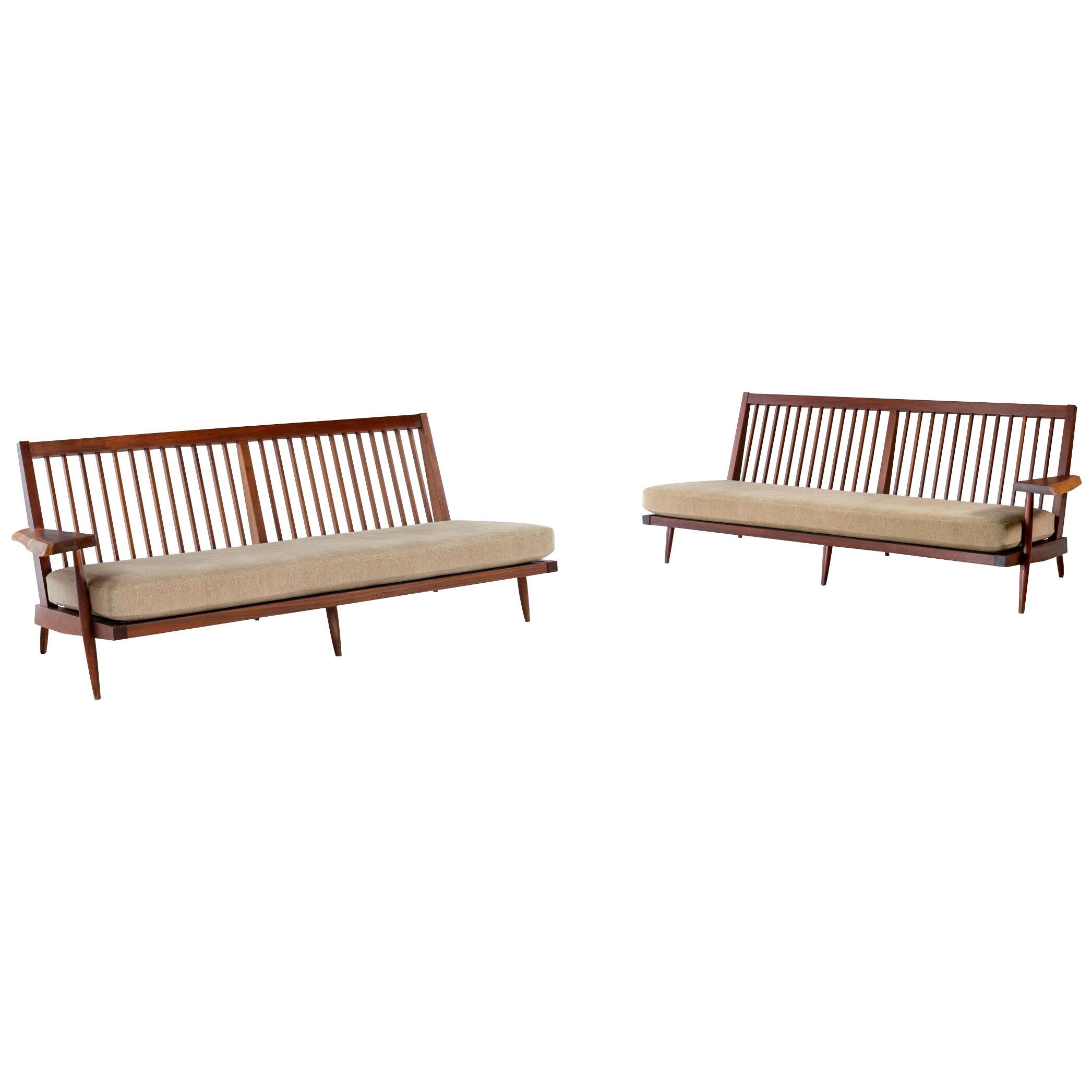 Pair of mid century walnut, Cushioned Settees with Free-Form Arm