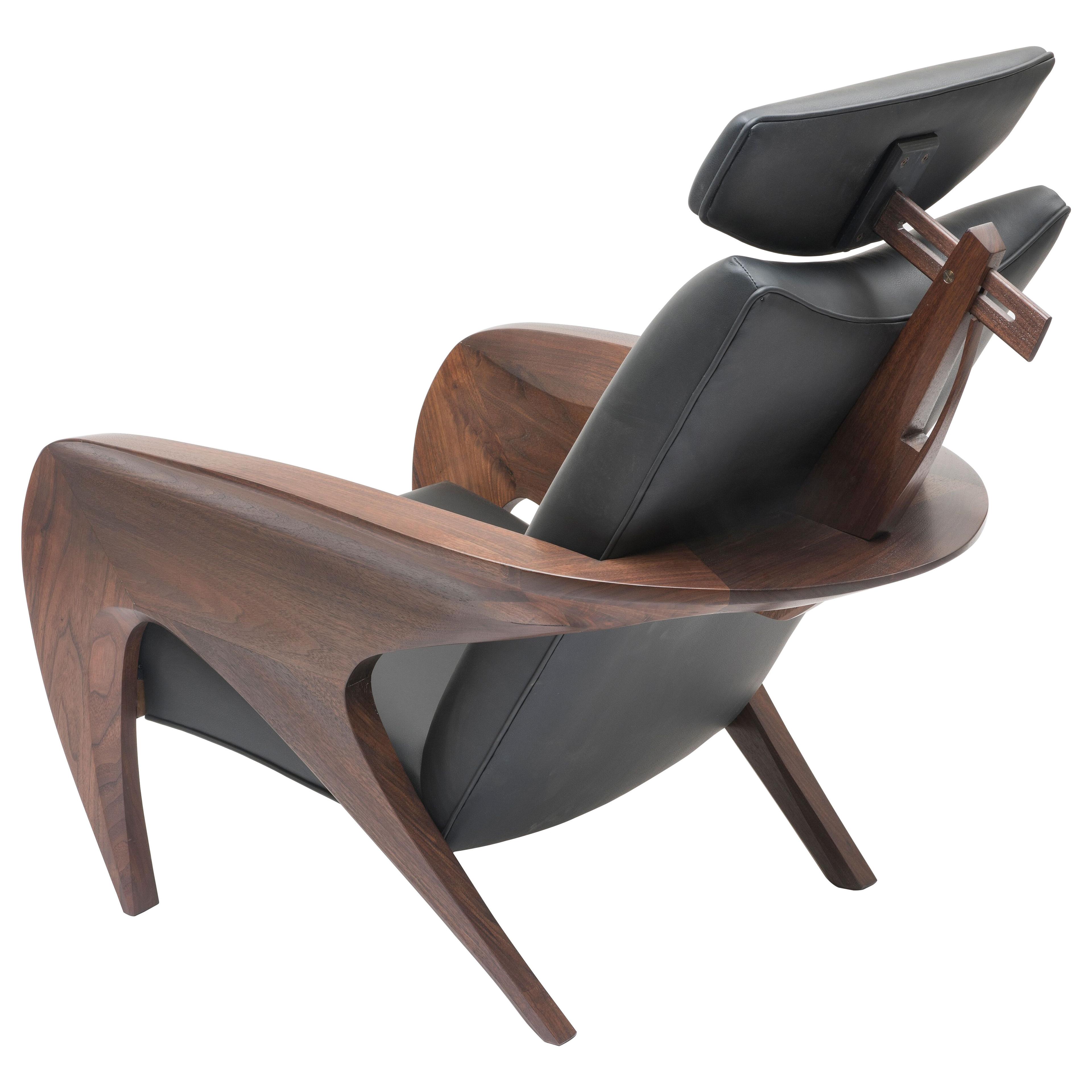 Contemporary ‘Swoop’ armchair in walnut and leather