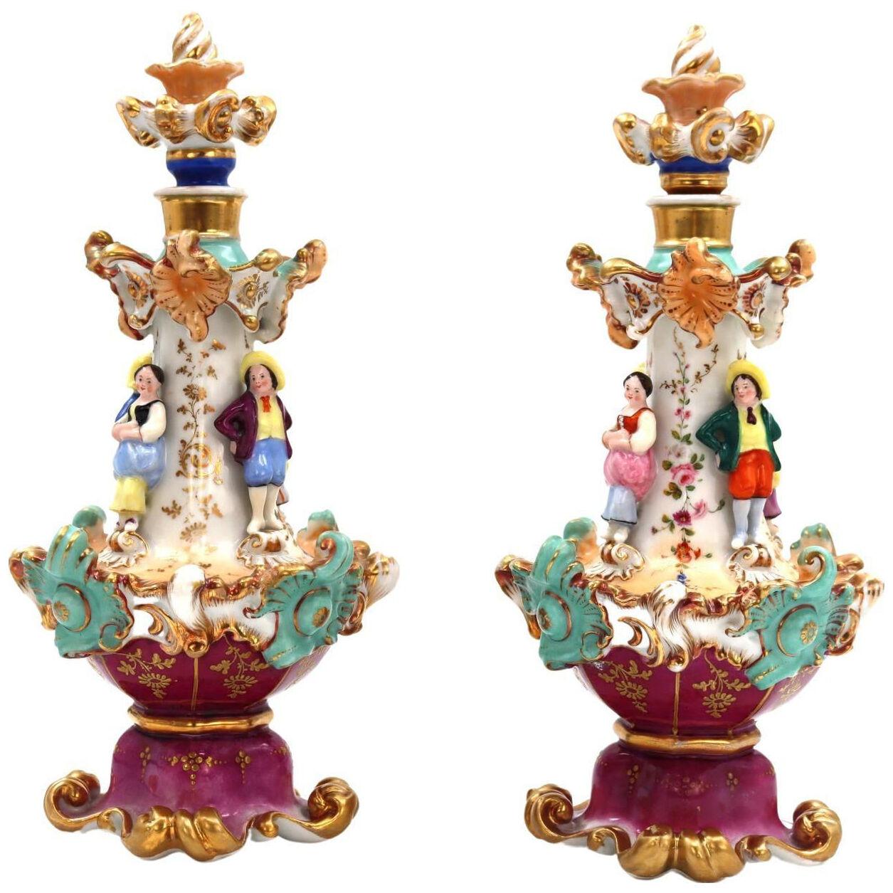 A pair of 19th century porcelain covered decanters