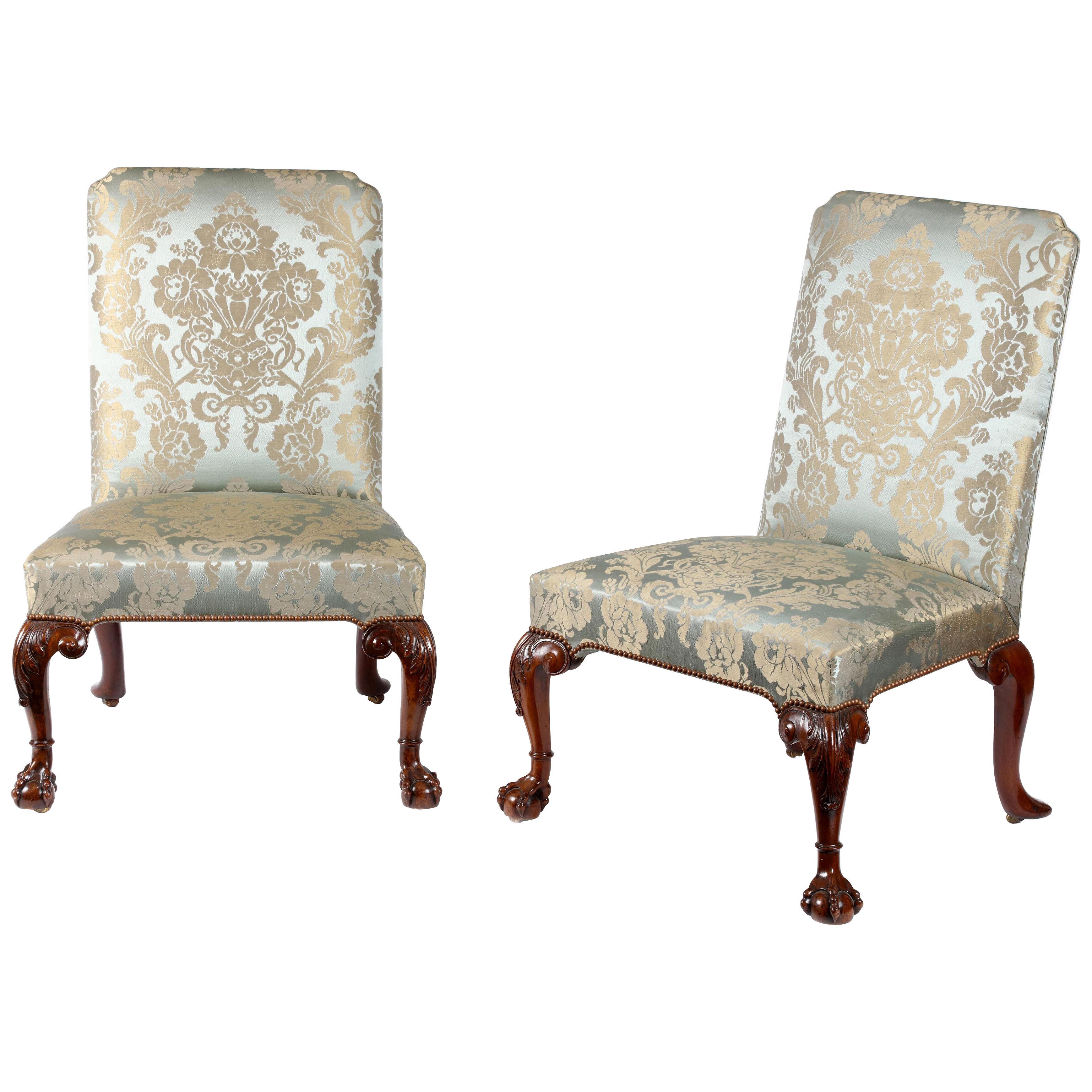 A pair of George II carved walnut side chairs attributed to William Hallet