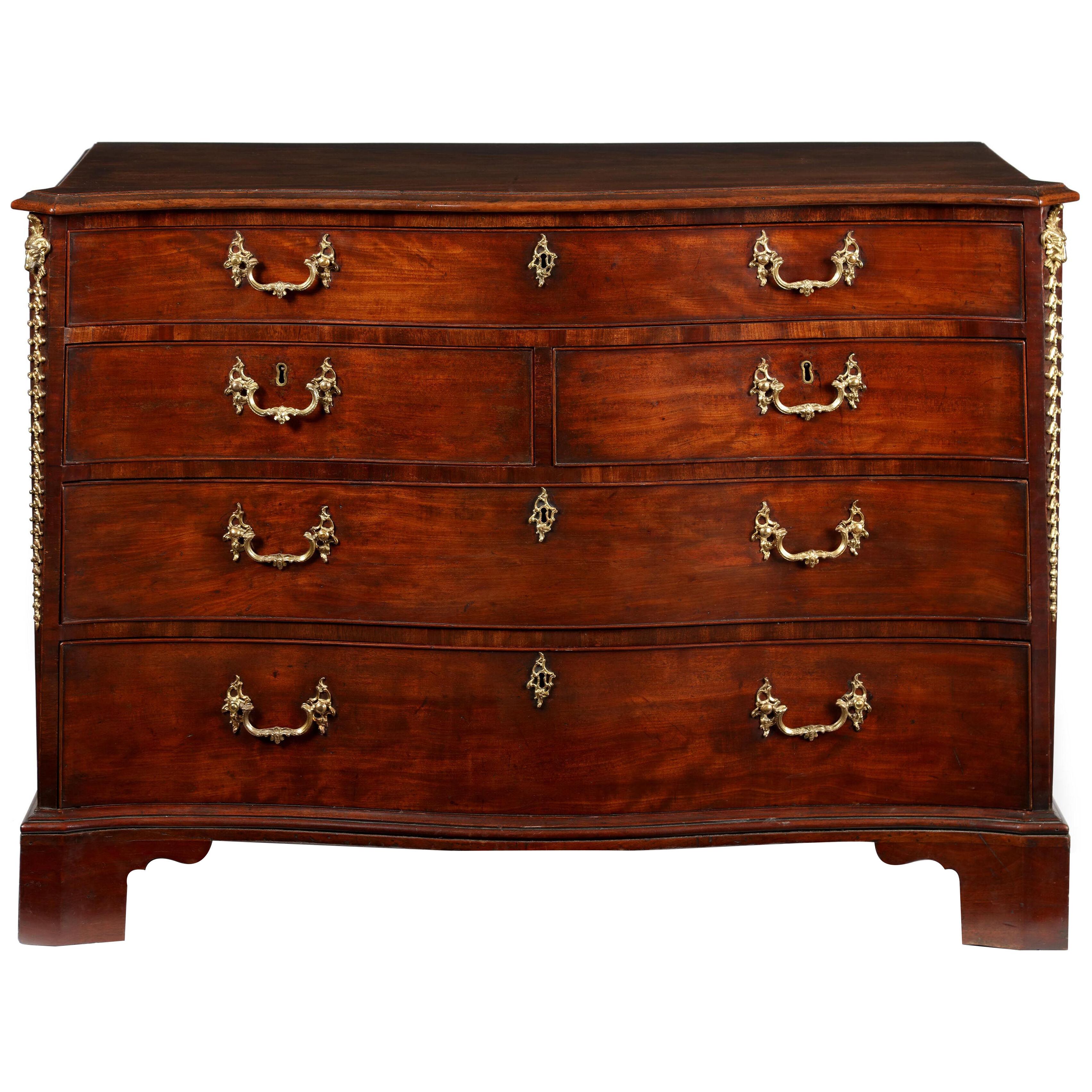 George III mahogany & brass mounted serpentine commode, manner of Ince & Mayhew