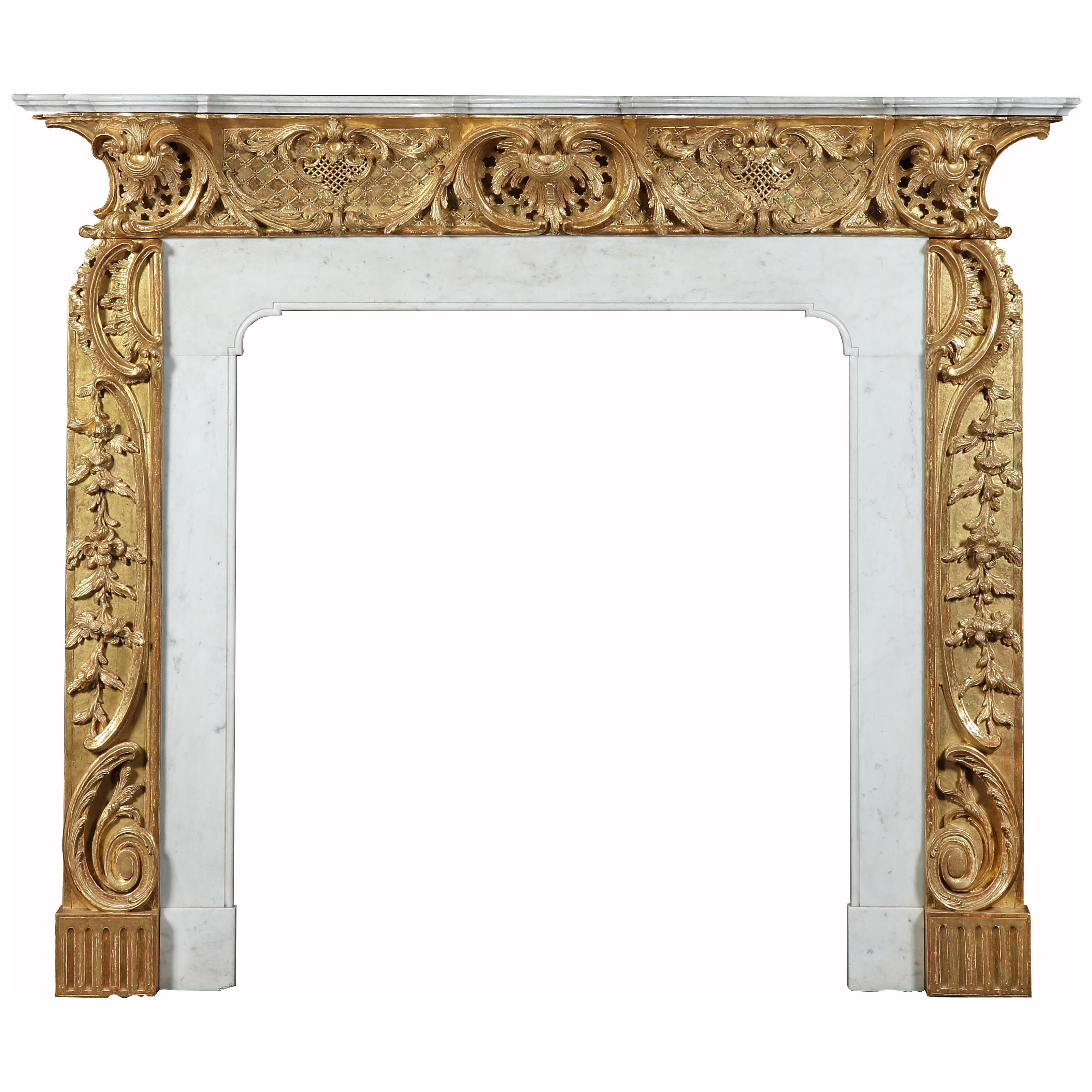 A GEORGE II GILTWOOD AND STATUARY MARBLE CHIMNEYPIECE 