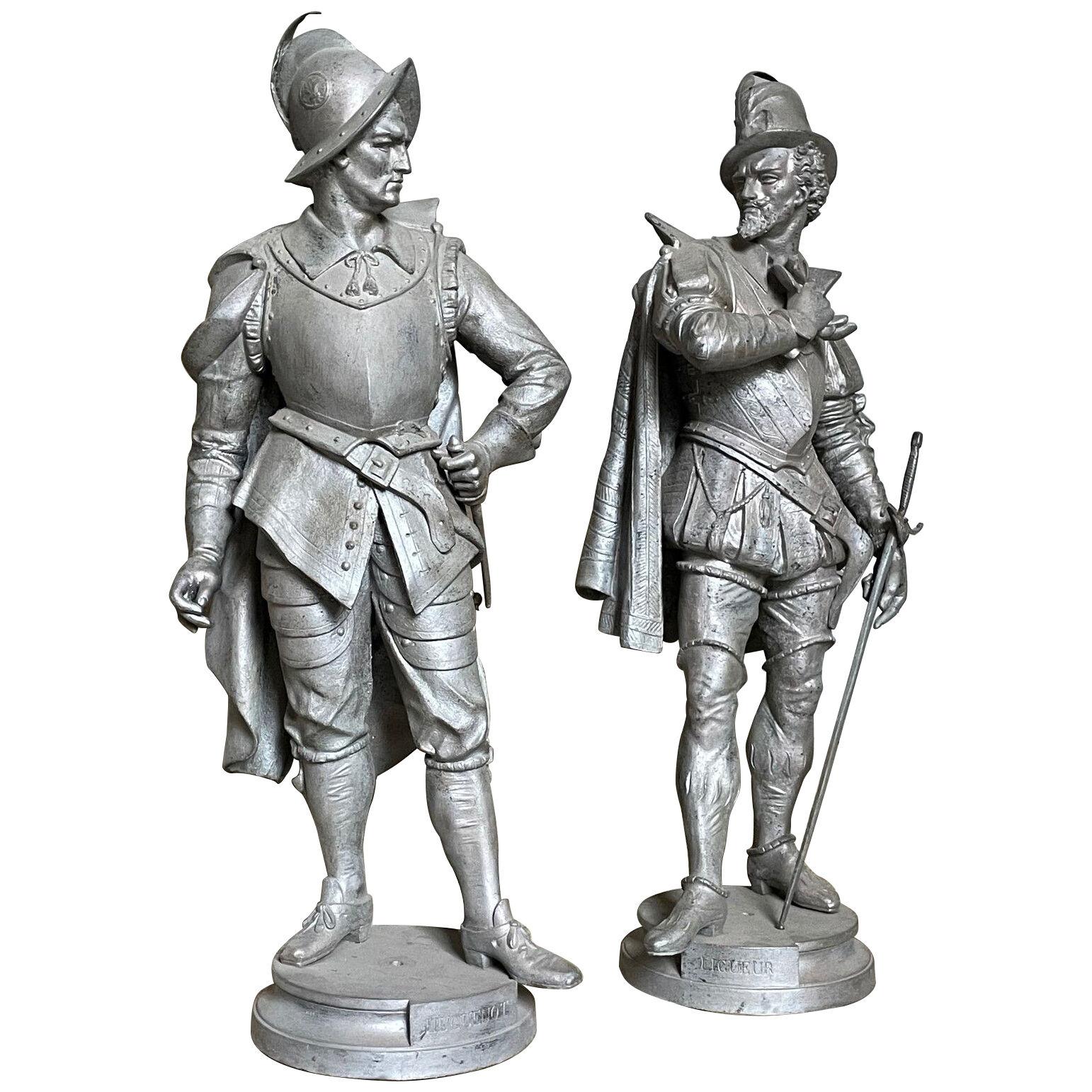 20th century leaguer and Huguenot metal statues 