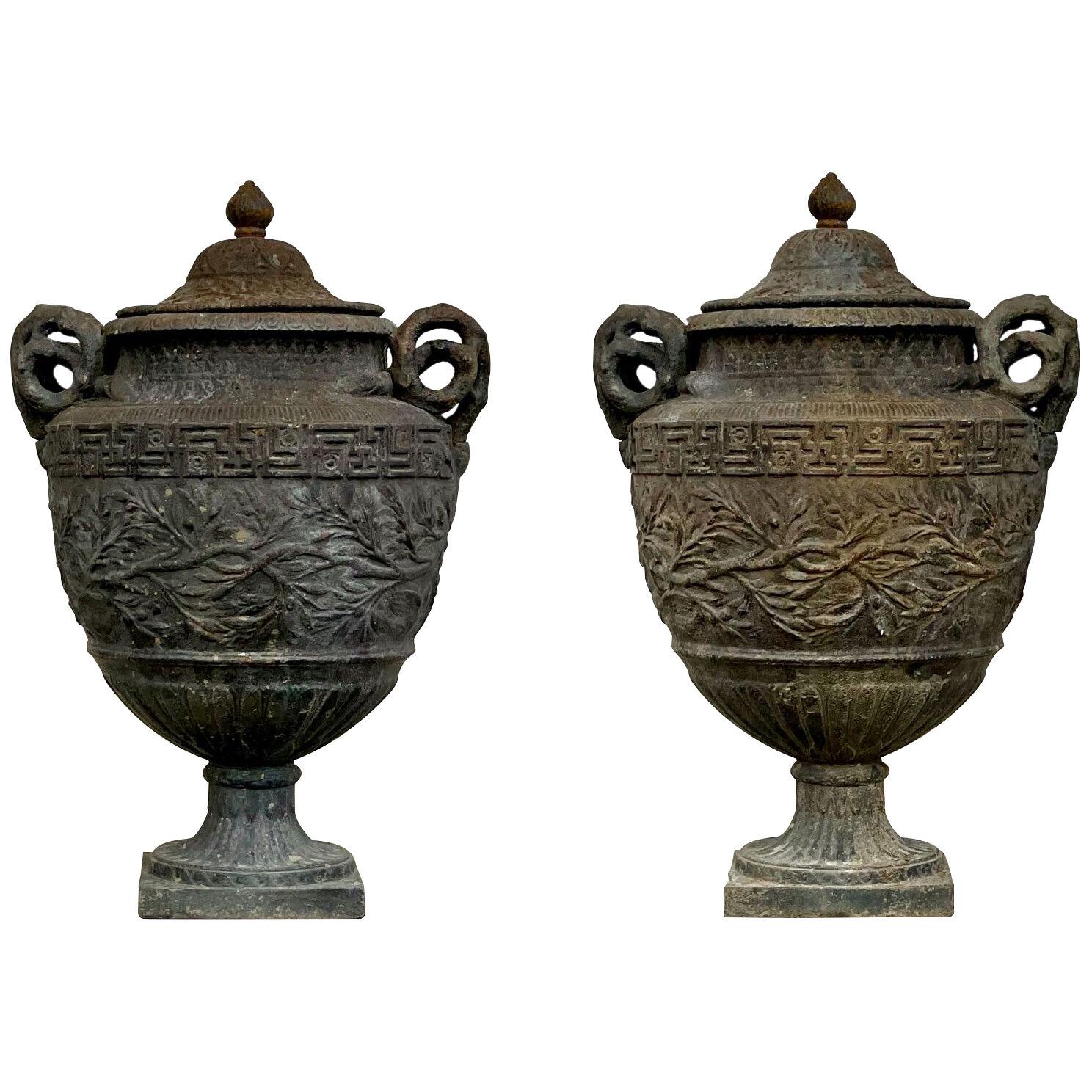 Pair of 19th century cast iron lidded vases
