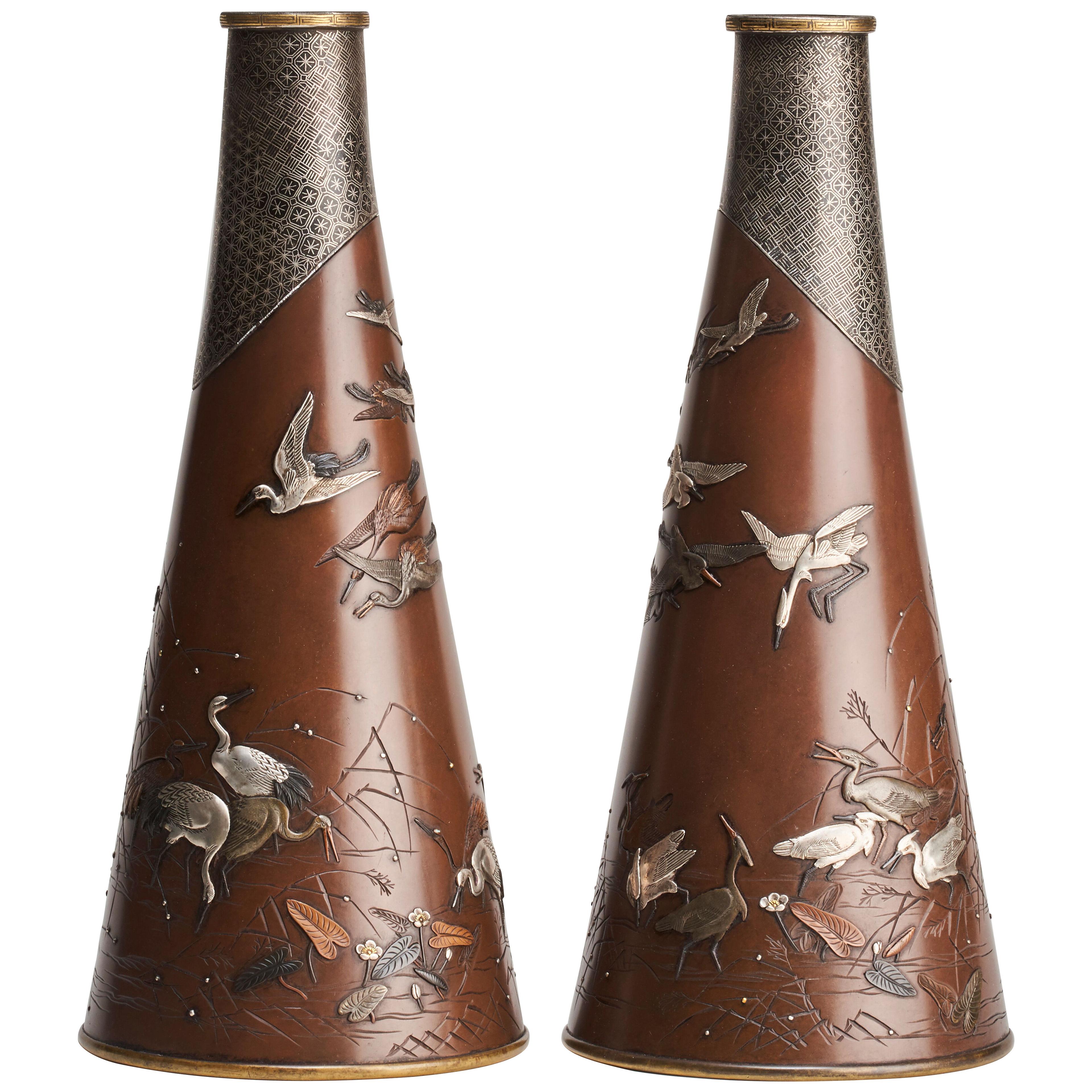 A fine and unusual pair of Japanese Bronze and multi-metal conical vases