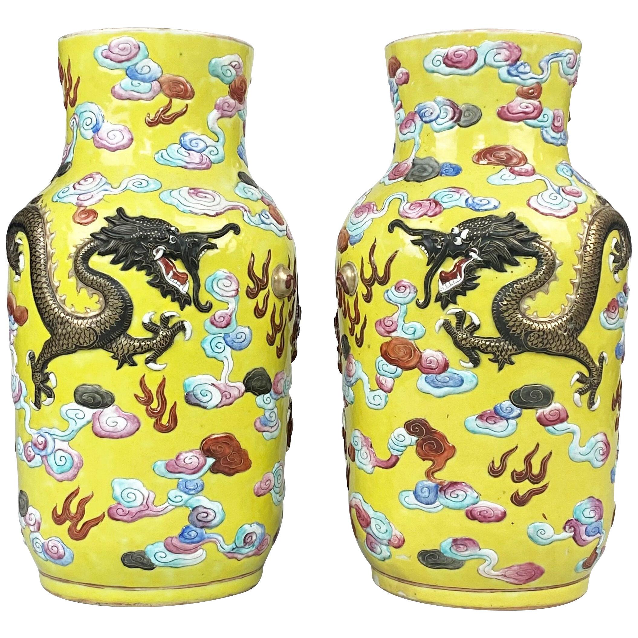 A dramatic pair of antique Chinese yellow ground Dragon vases