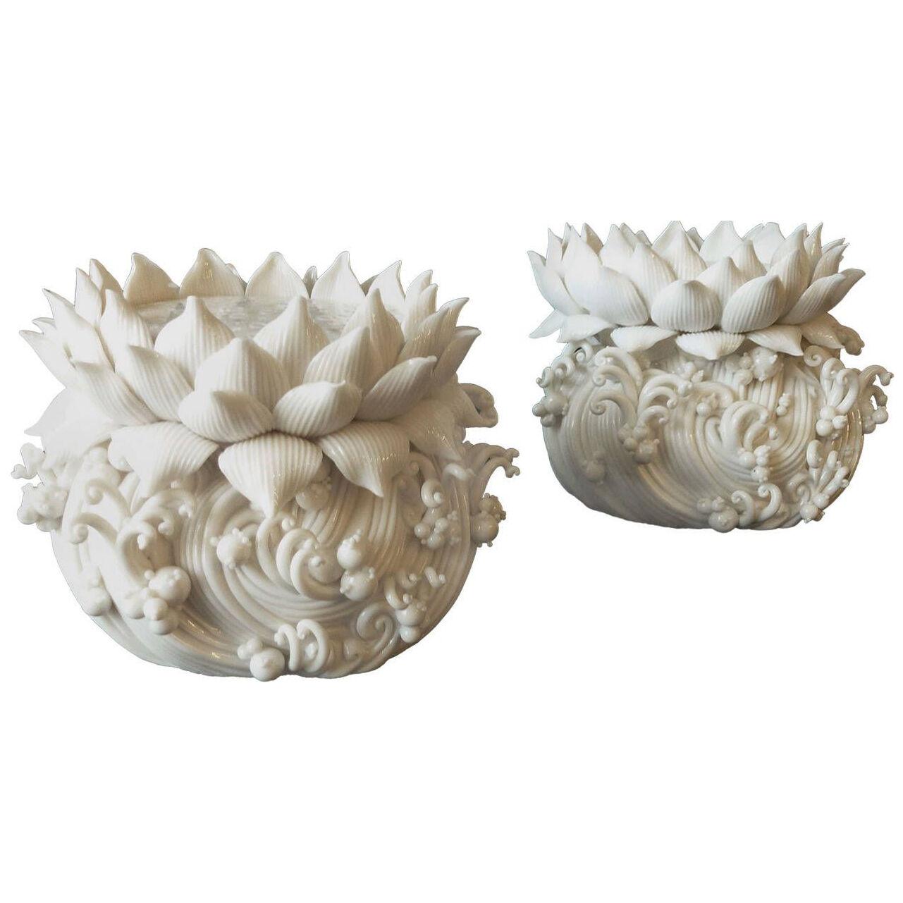A pair of Lotus candle holders