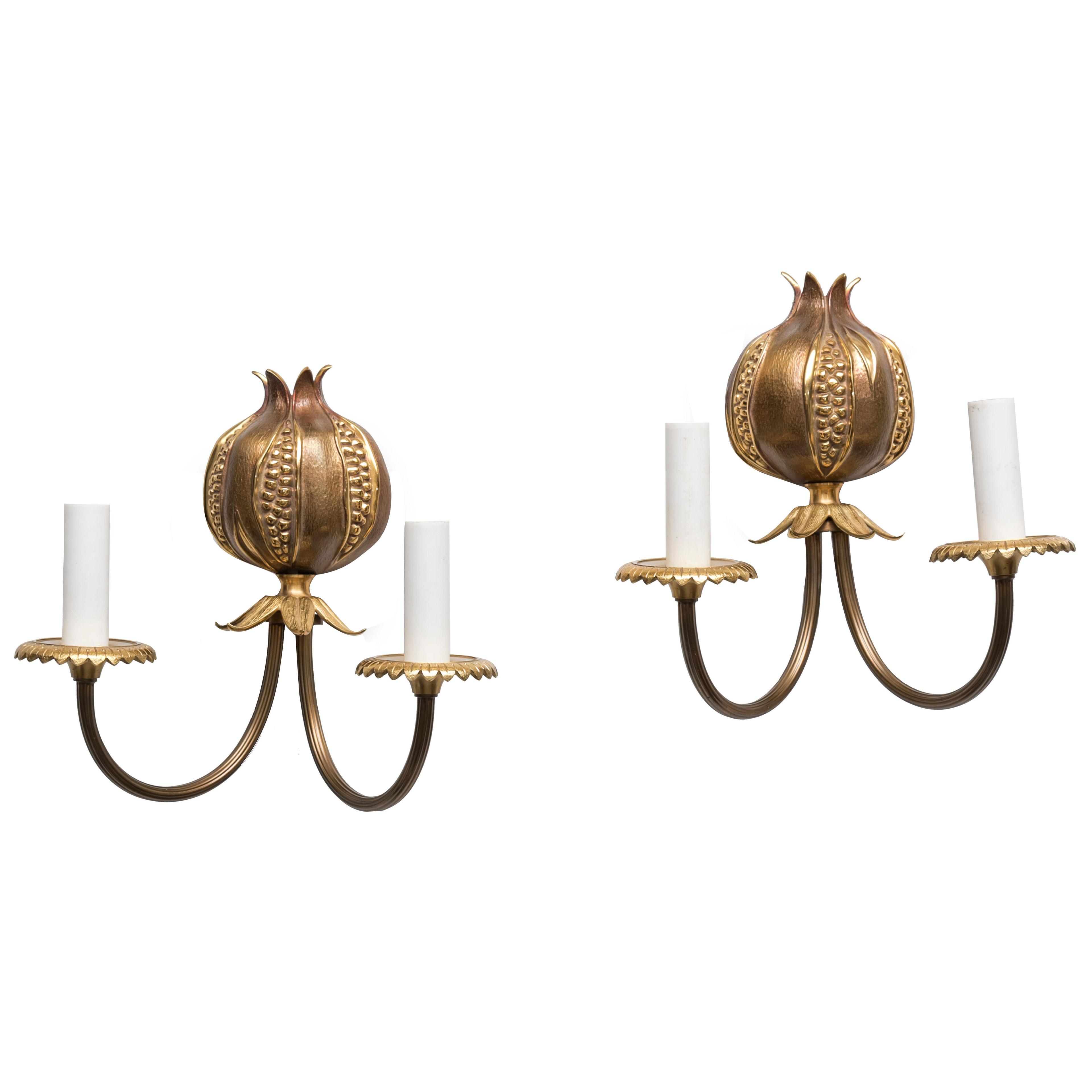 Pair of patinated bronze sconces by Maison Charles .