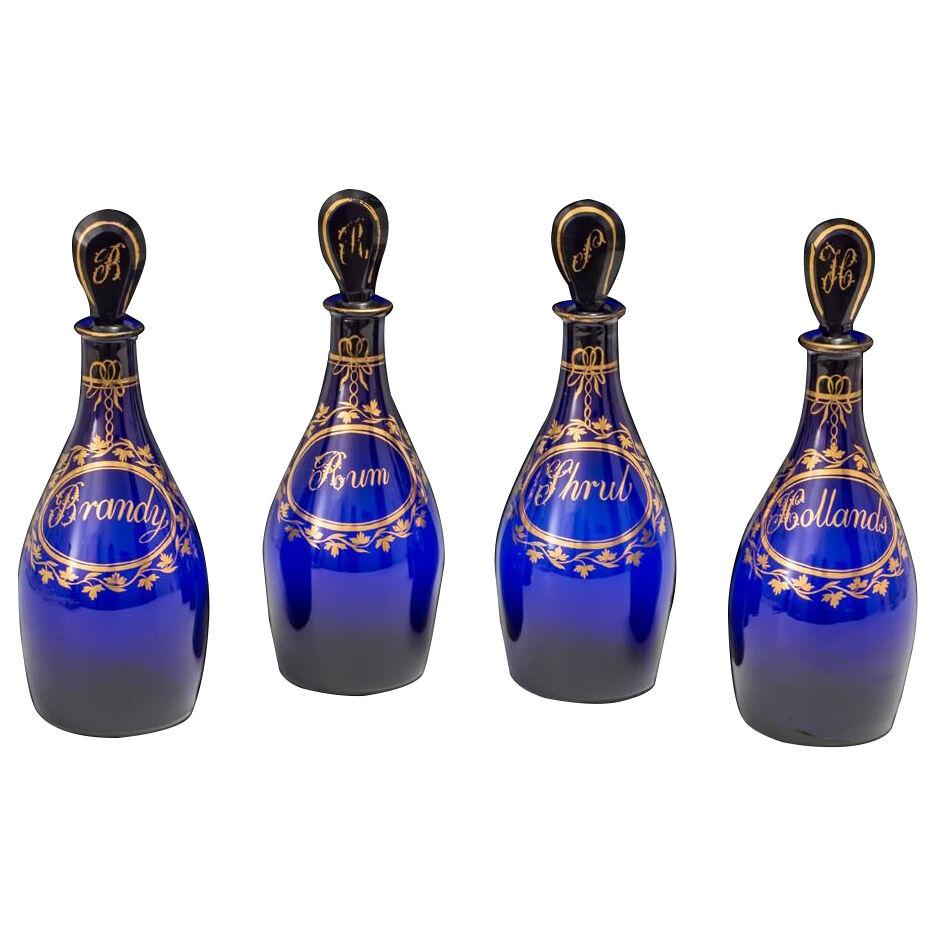 A Fine Set Of Four Bristol Blue Gilt Label Antique Georgian Decanters